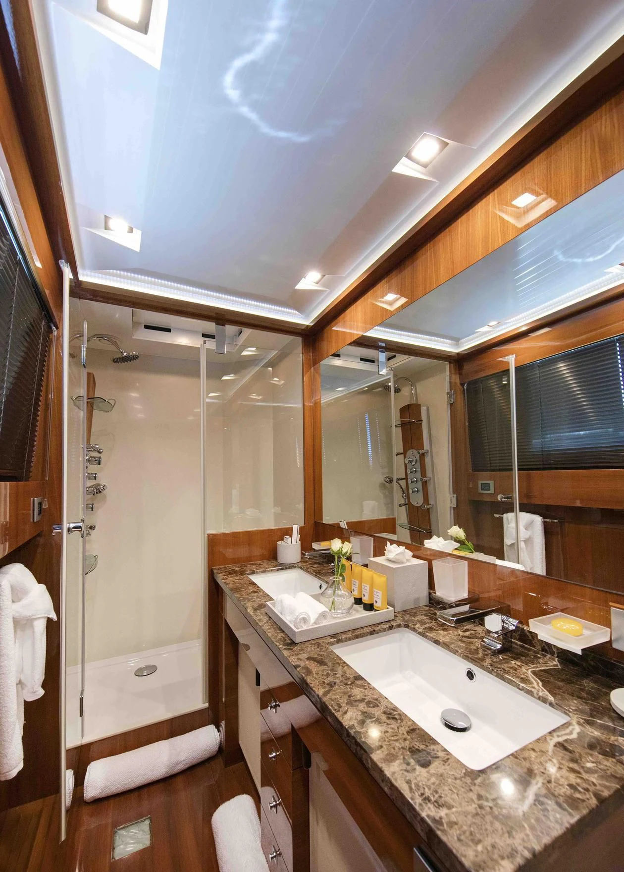 a bathroom with a sink and a shower aboard APMONIA Yacht for Sale