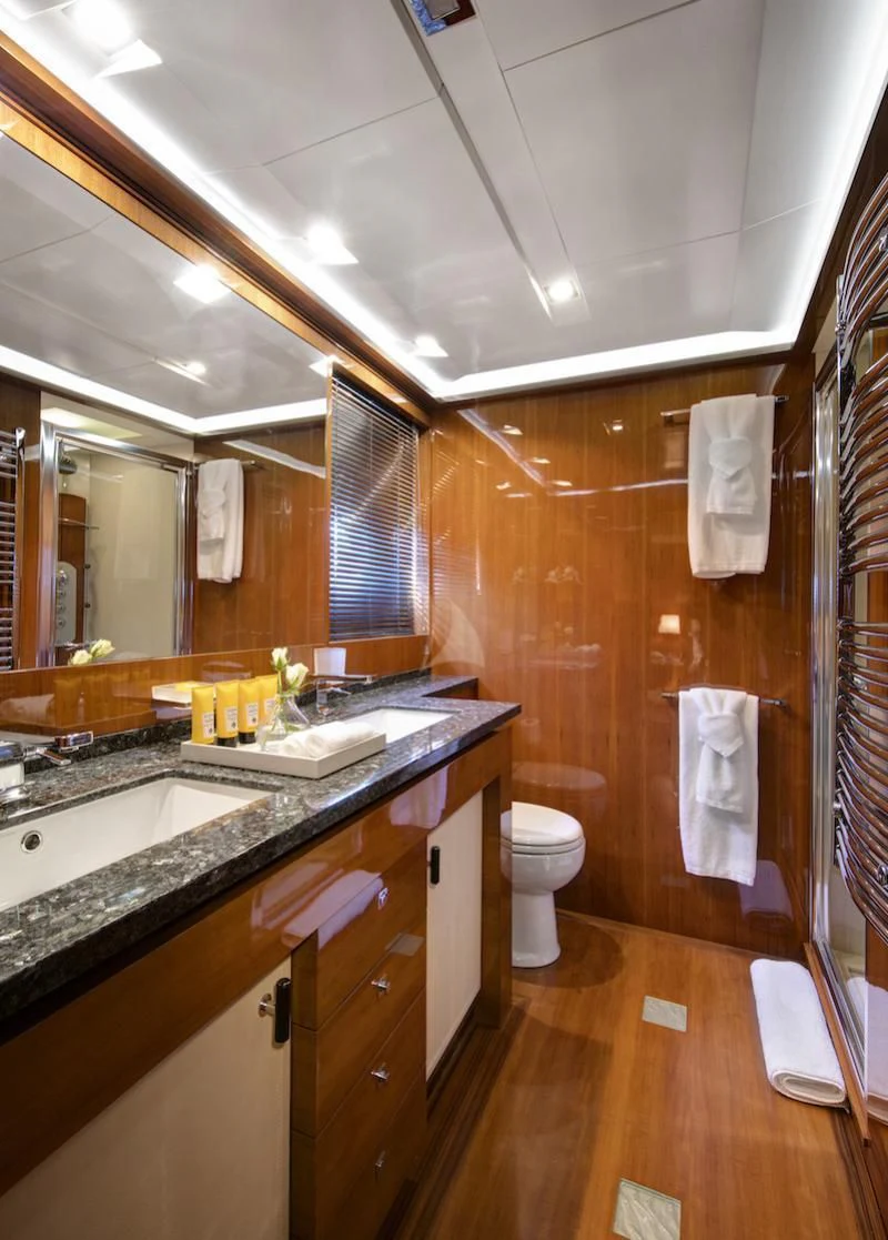 a bathroom with a sink and a toilet aboard APMONIA Yacht for Sale