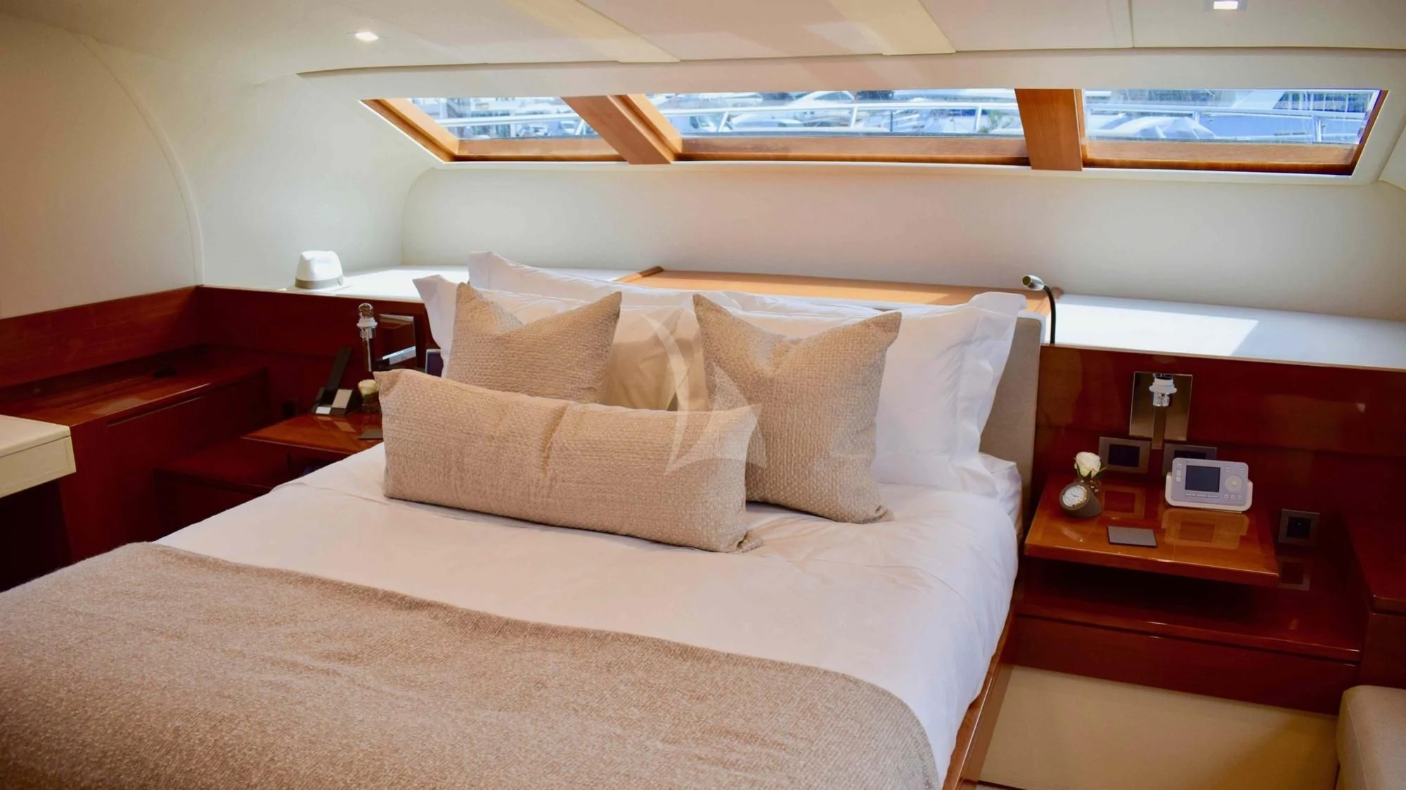 a bed with a white comforter aboard APMONIA Yacht for Sale