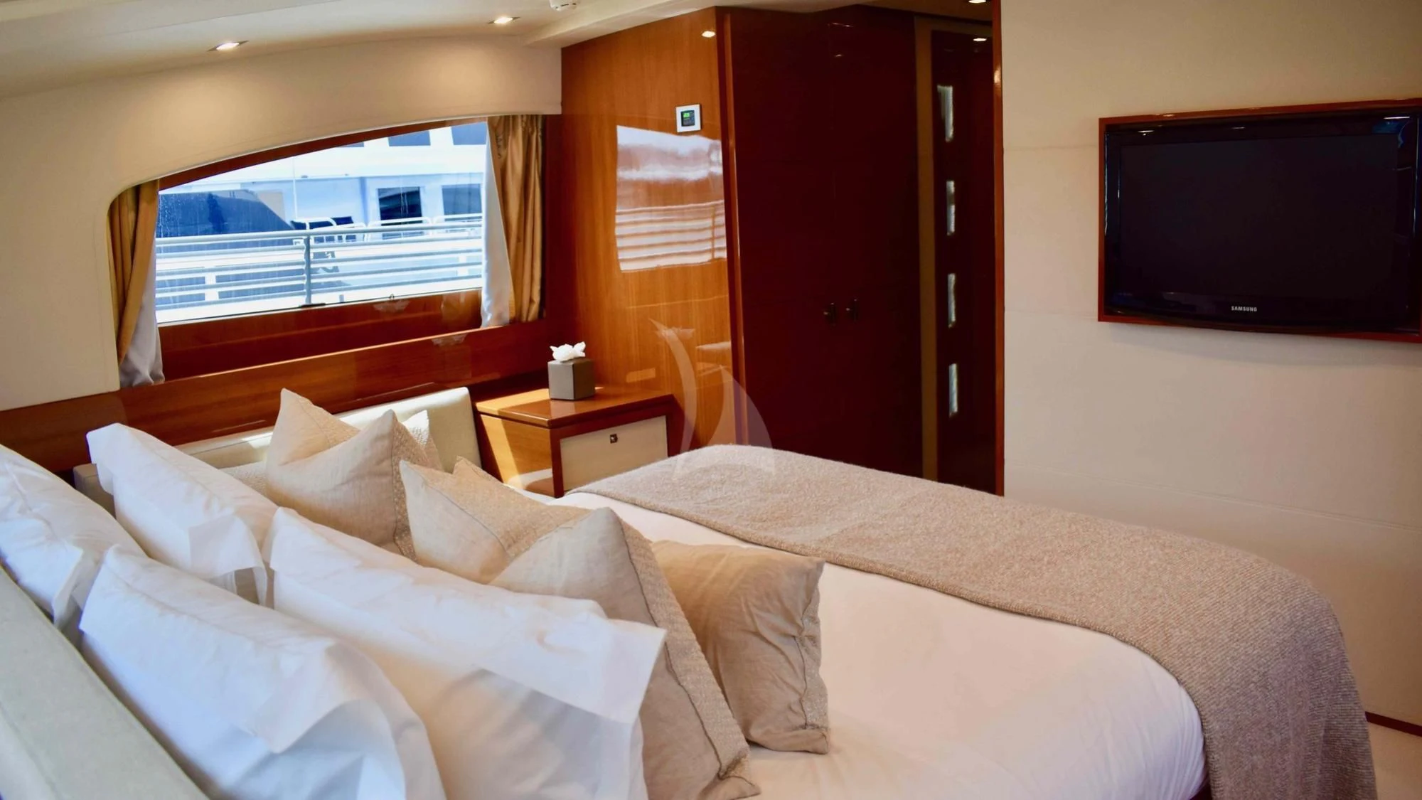 a bed with white sheets aboard APMONIA Yacht for Sale