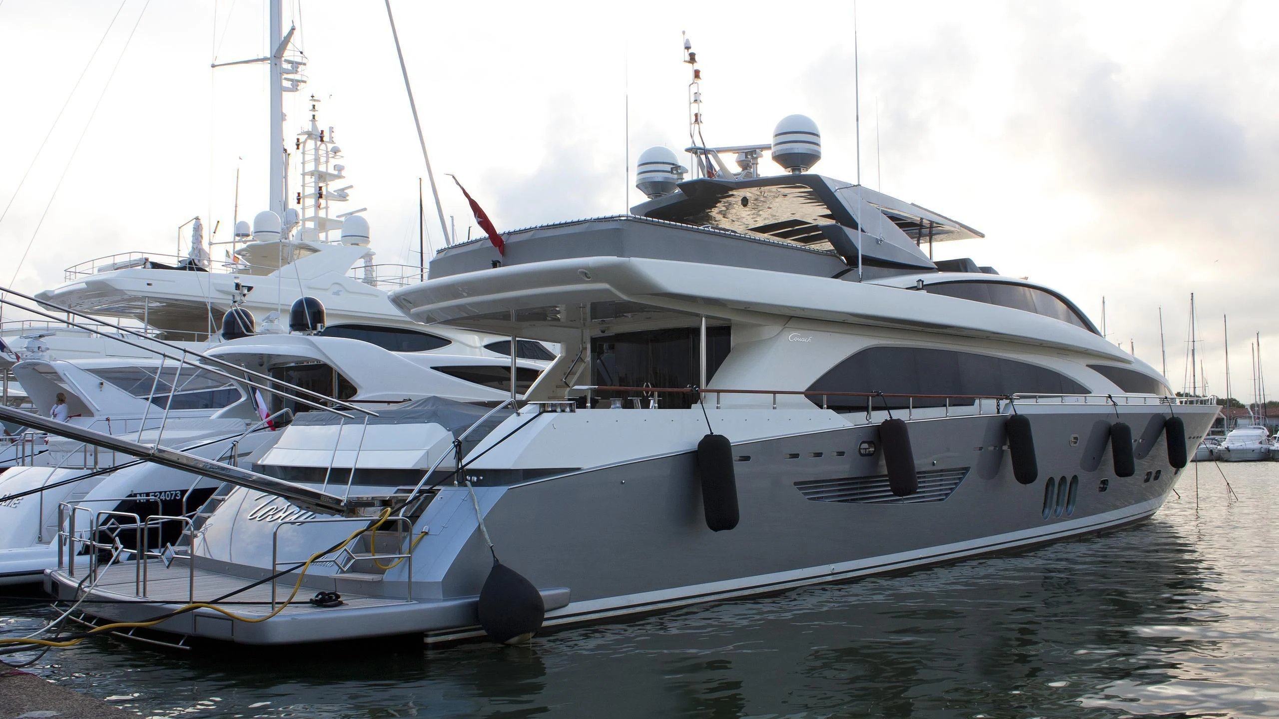 a white boat in the water aboard APMONIA Yacht for Sale