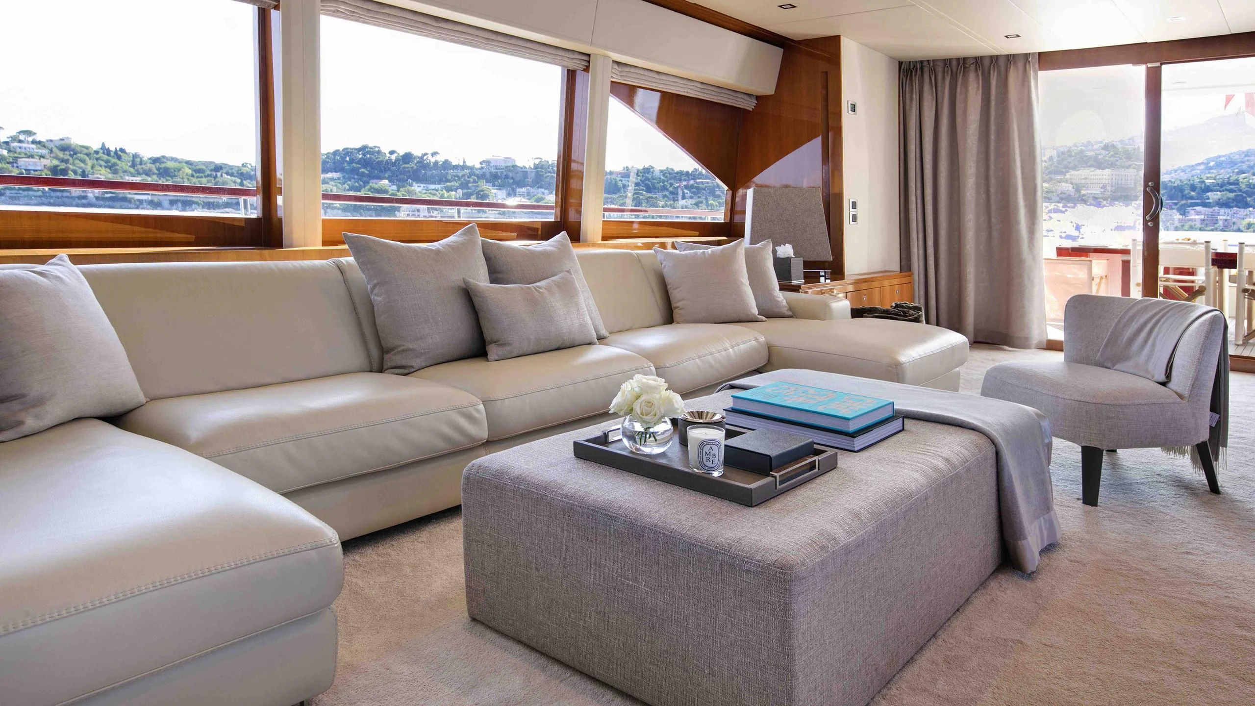 a living room with a couch and a coffee table aboard APMONIA Yacht for Sale