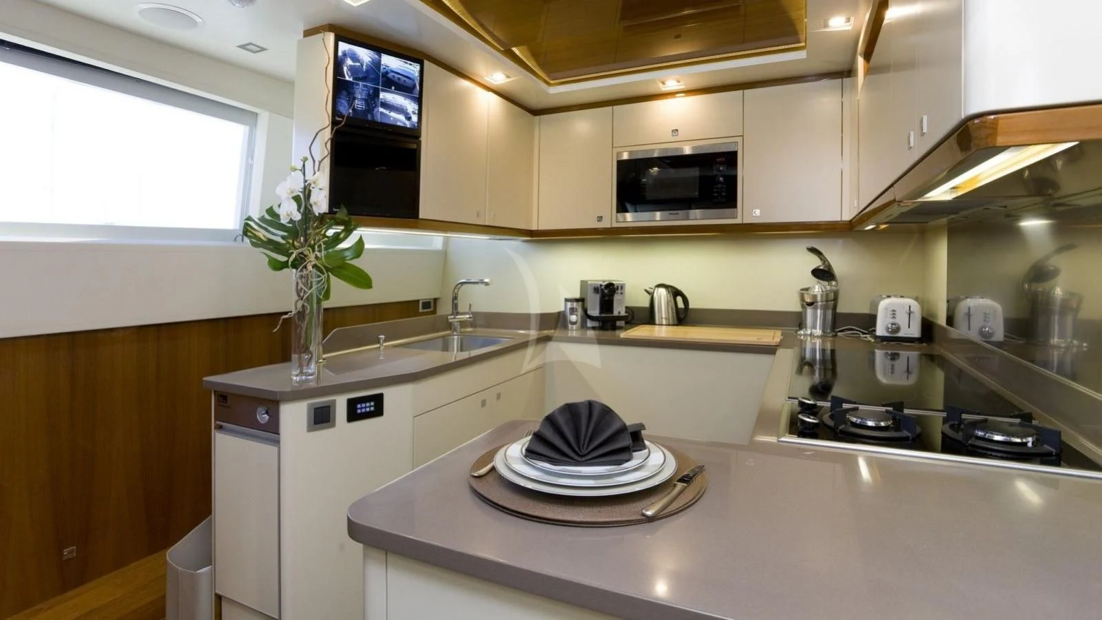 a kitchen with a sink and a microwave aboard APMONIA Yacht for Sale