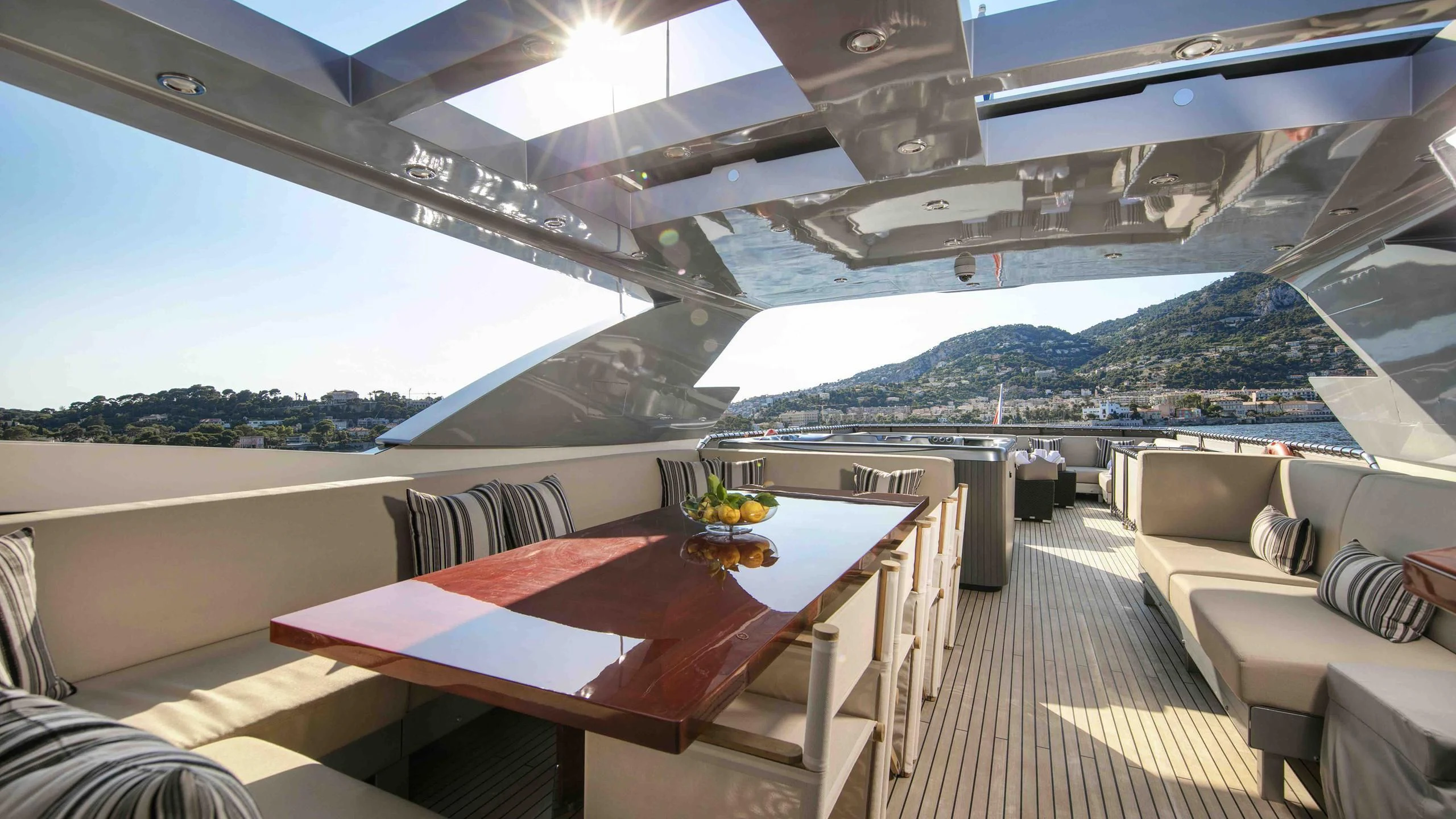 a room with a table and chairs aboard APMONIA Yacht for Sale
