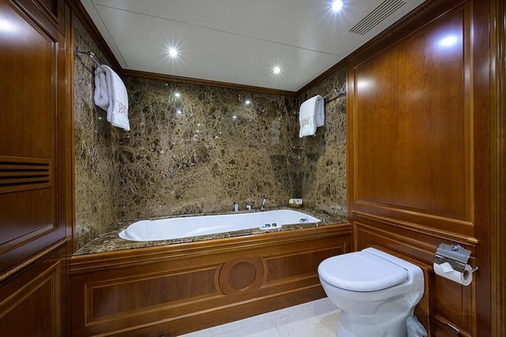 a bathroom with a bathtub and toilet aboard ARTEMIS Yacht for Sale