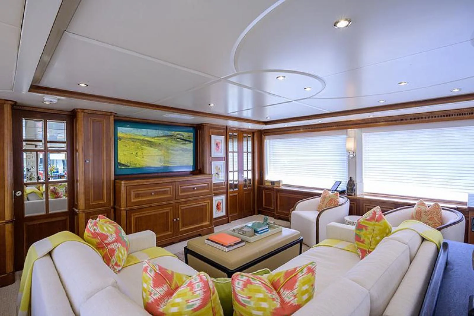 a living room with a tv and couches aboard ARTEMIS Yacht for Sale