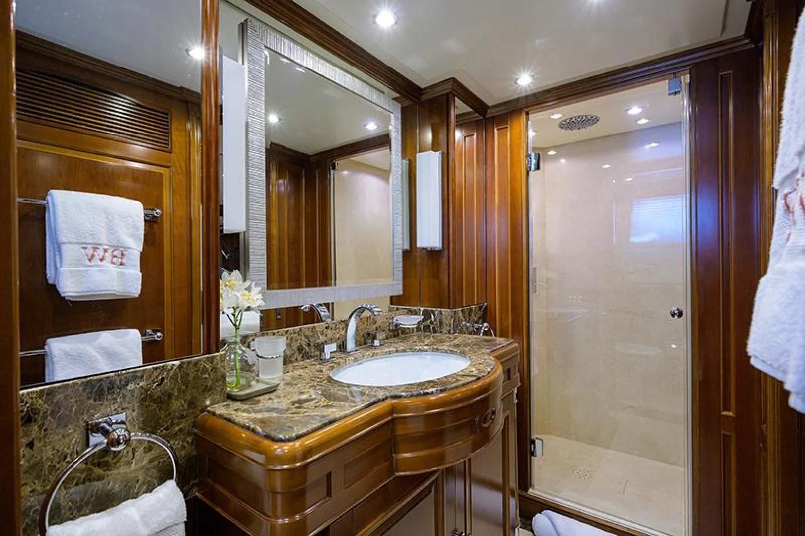 a bathroom with a sink and mirror aboard ARTEMIS Yacht for Sale