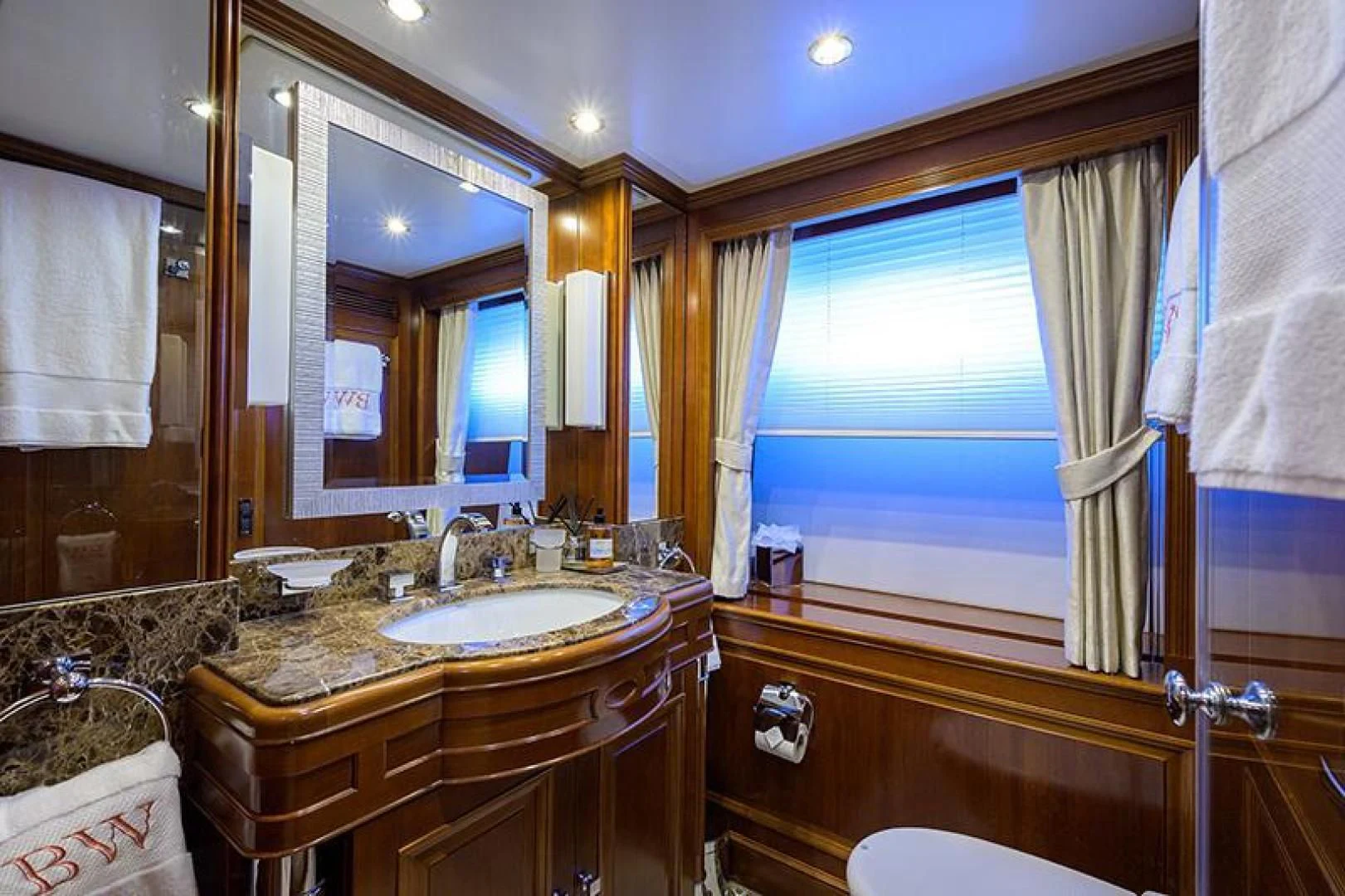 a bathroom with a sink and a mirror aboard ARTEMIS Yacht for Sale