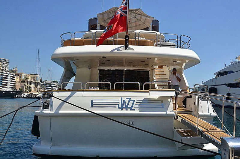 a boat with a flag on the front aboard ARTEMIS Yacht for Sale