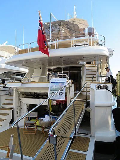 a boat with a flag on the deck aboard ARTEMIS Yacht for Sale