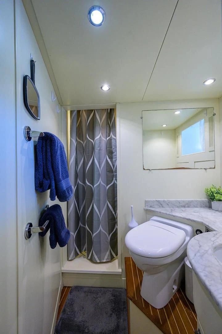 a bathroom with a sink and a mirror aboard ARTEMIS Yacht for Sale