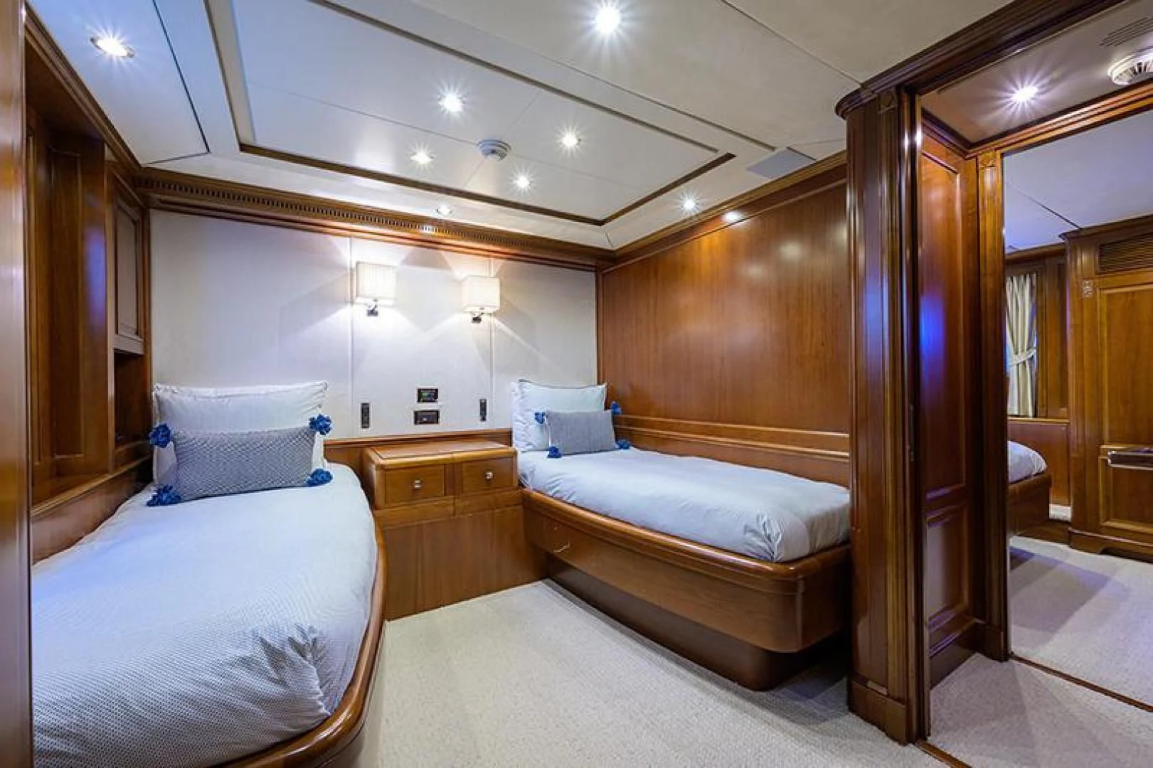 a room with a bed and a mirror aboard ARTEMIS Yacht for Sale