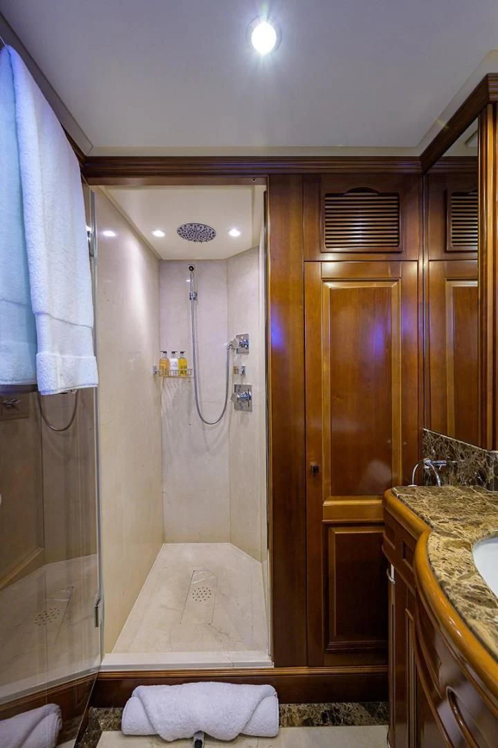 a bathroom with a shower and sink aboard ARTEMIS Yacht for Sale