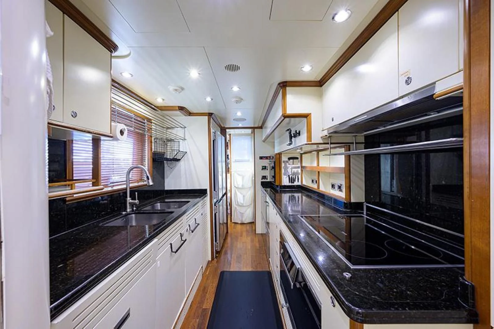 a kitchen with black counters aboard ARTEMIS Yacht for Sale