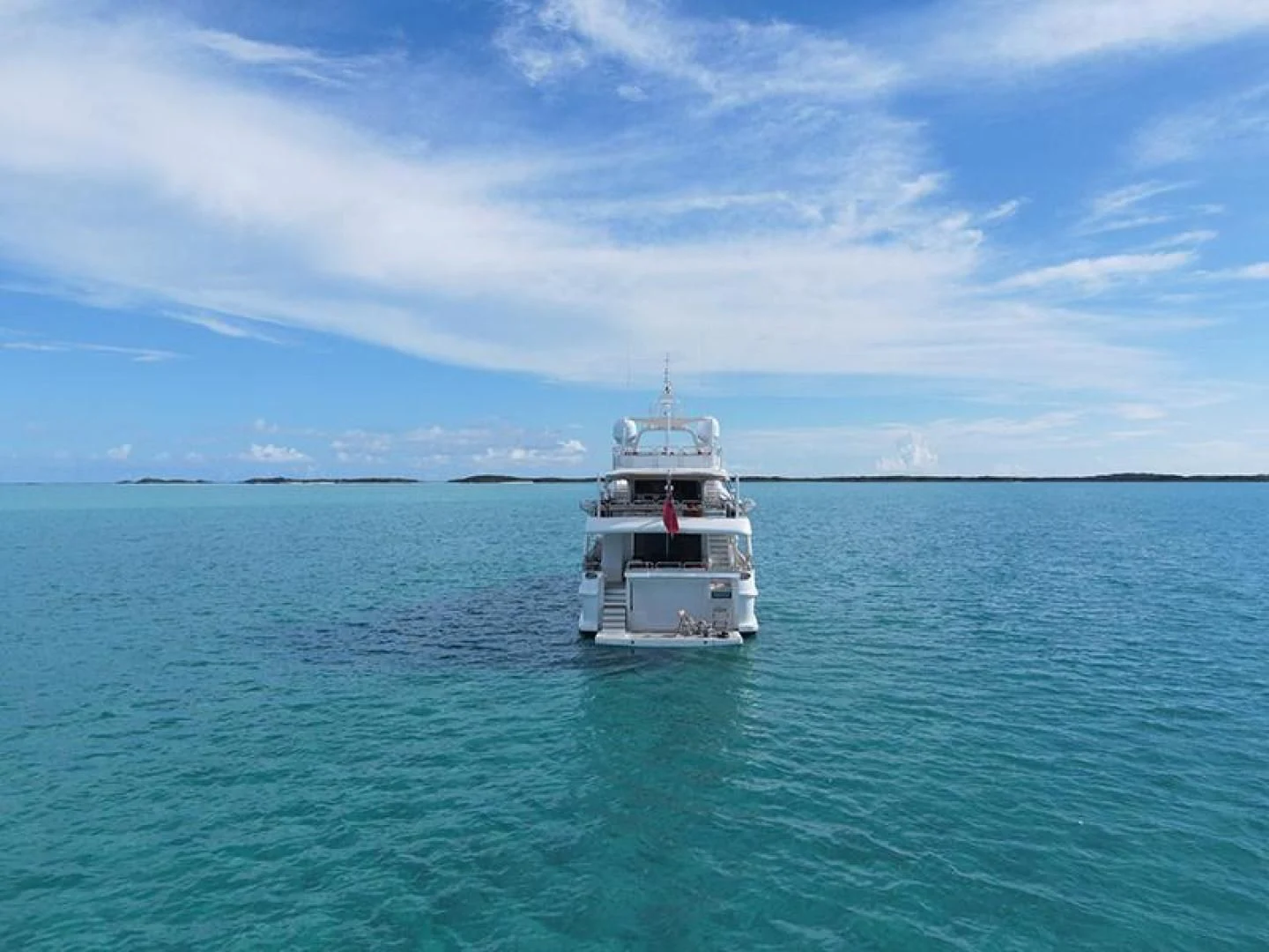 a small white boat in the water aboard ARTEMIS Yacht for Sale