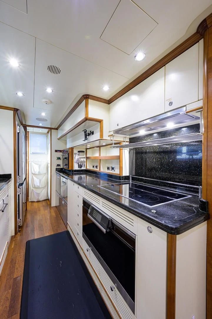 a kitchen with a stove and a sink aboard ARTEMIS Yacht for Sale