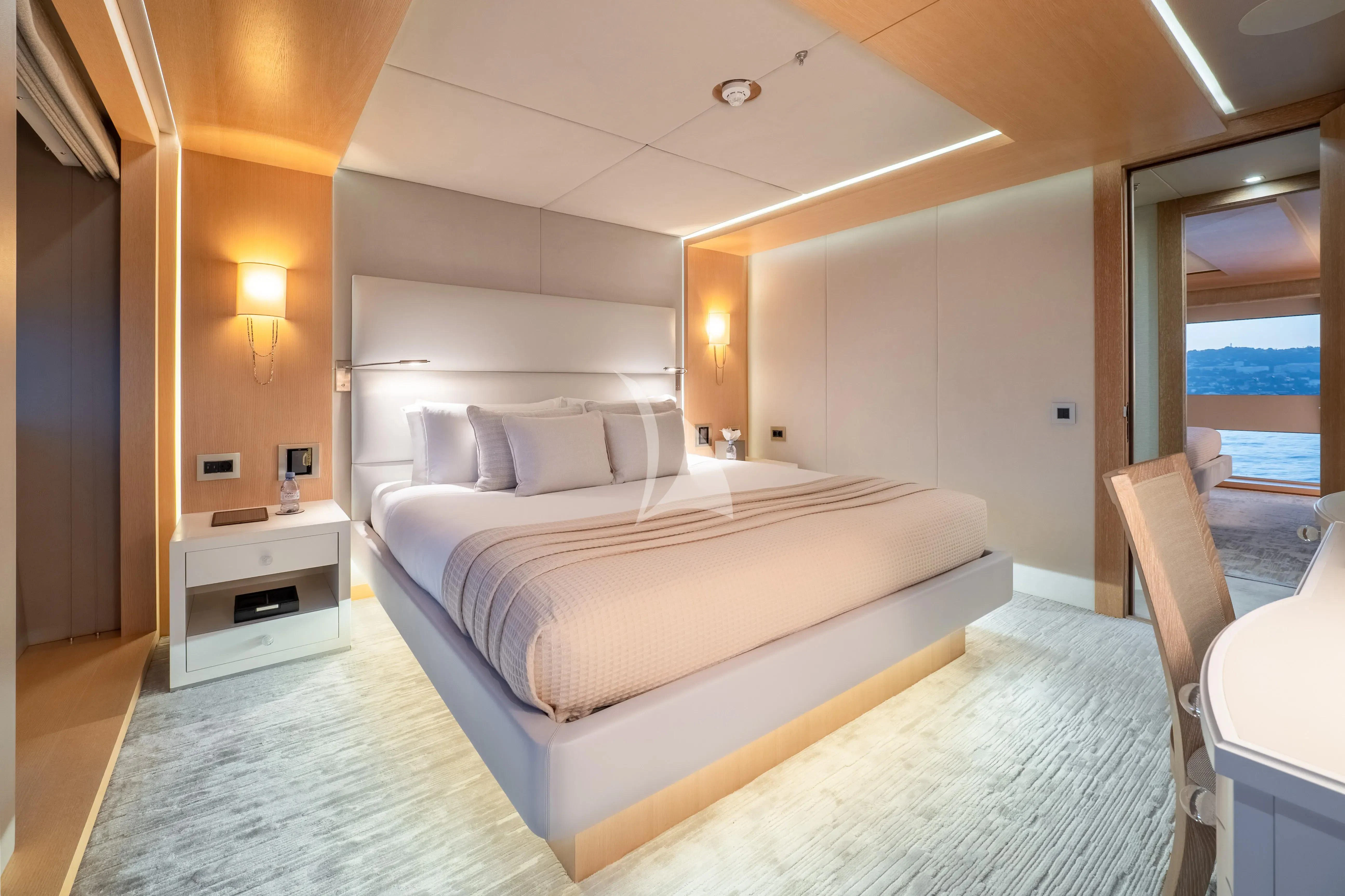 a large bedroom with a bed aboard ARADOS Yacht for Charter