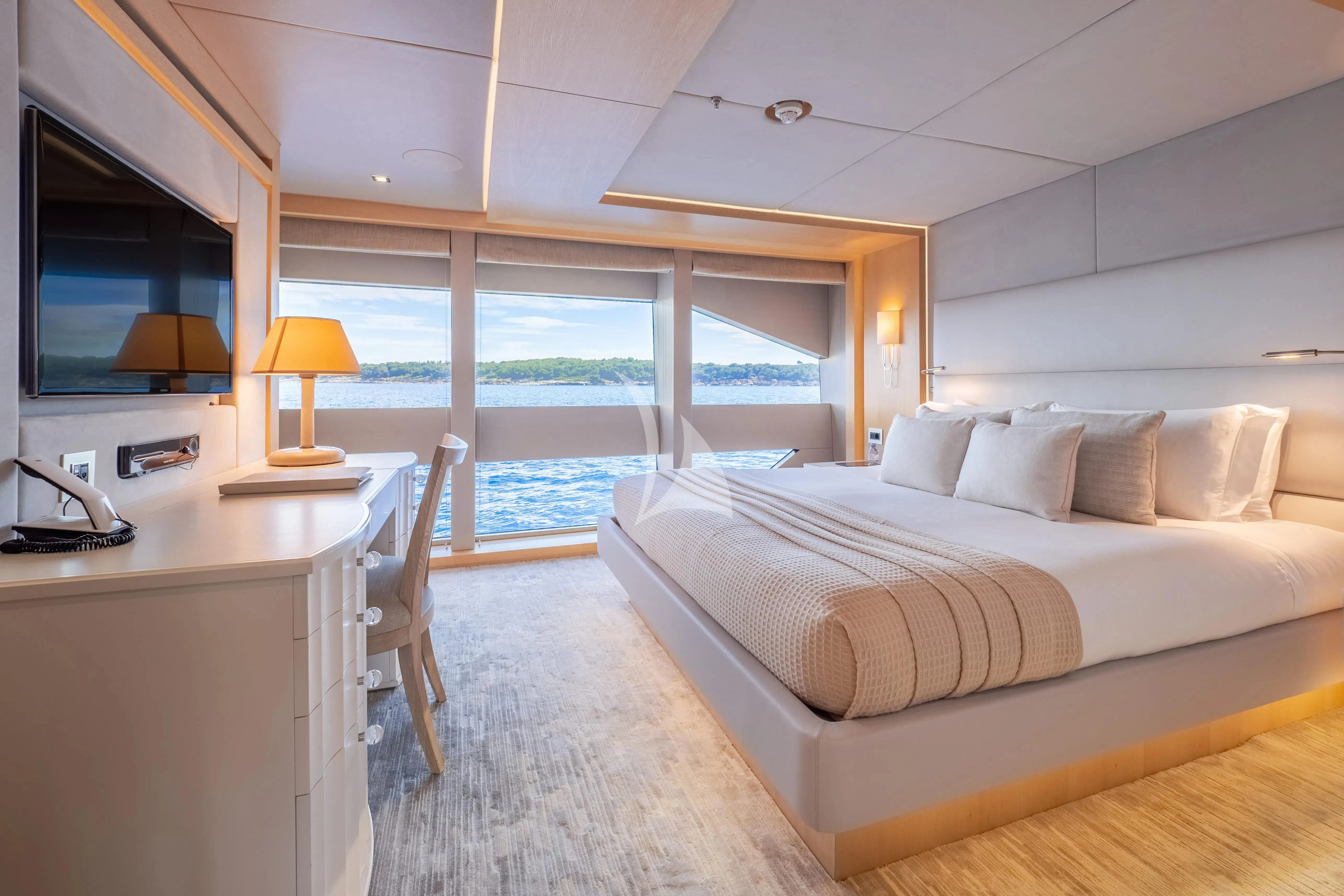 a bedroom with a large bed aboard ARADOS Yacht for Charter