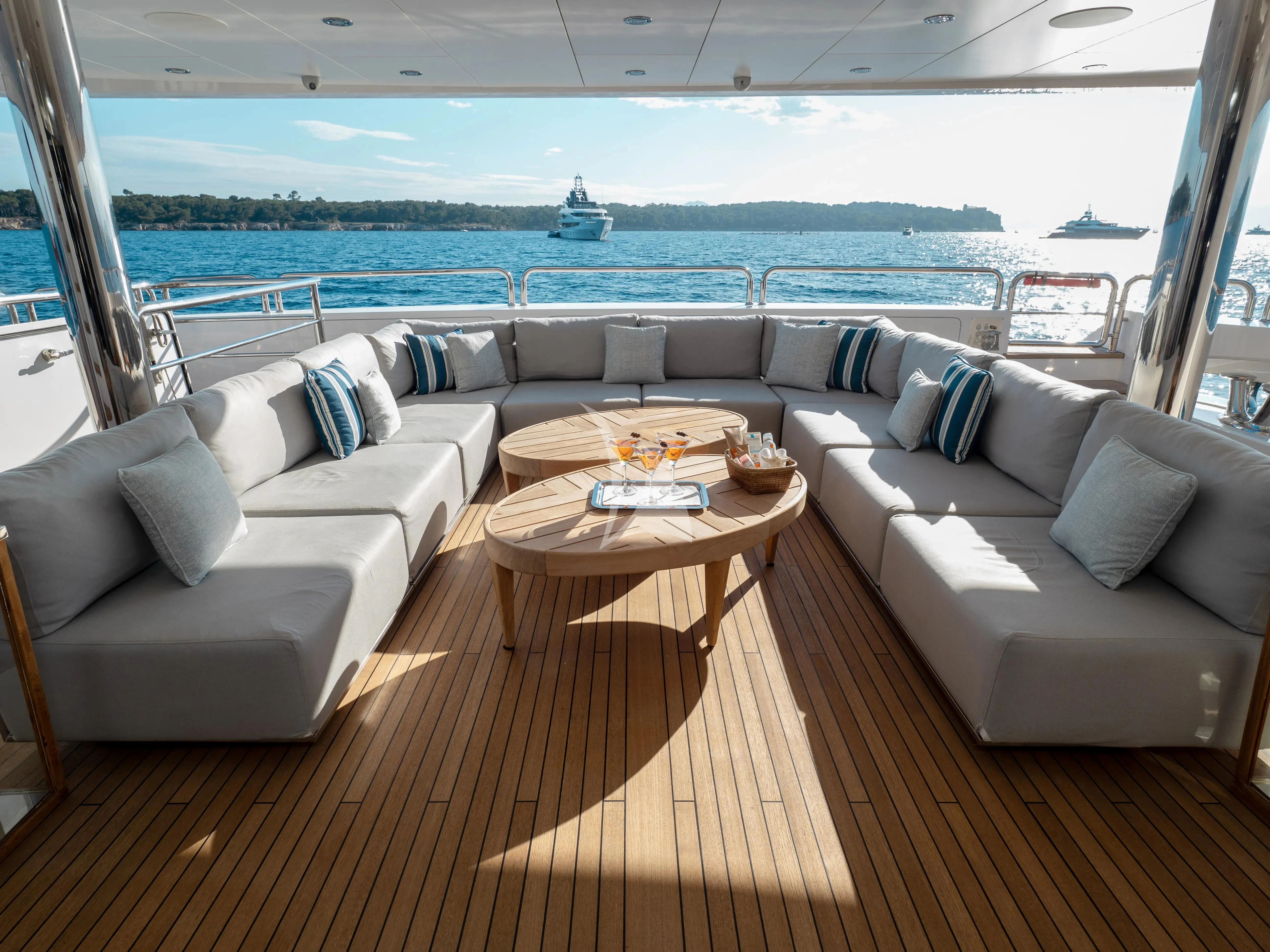 a living room with a large window aboard ARADOS Yacht for Charter