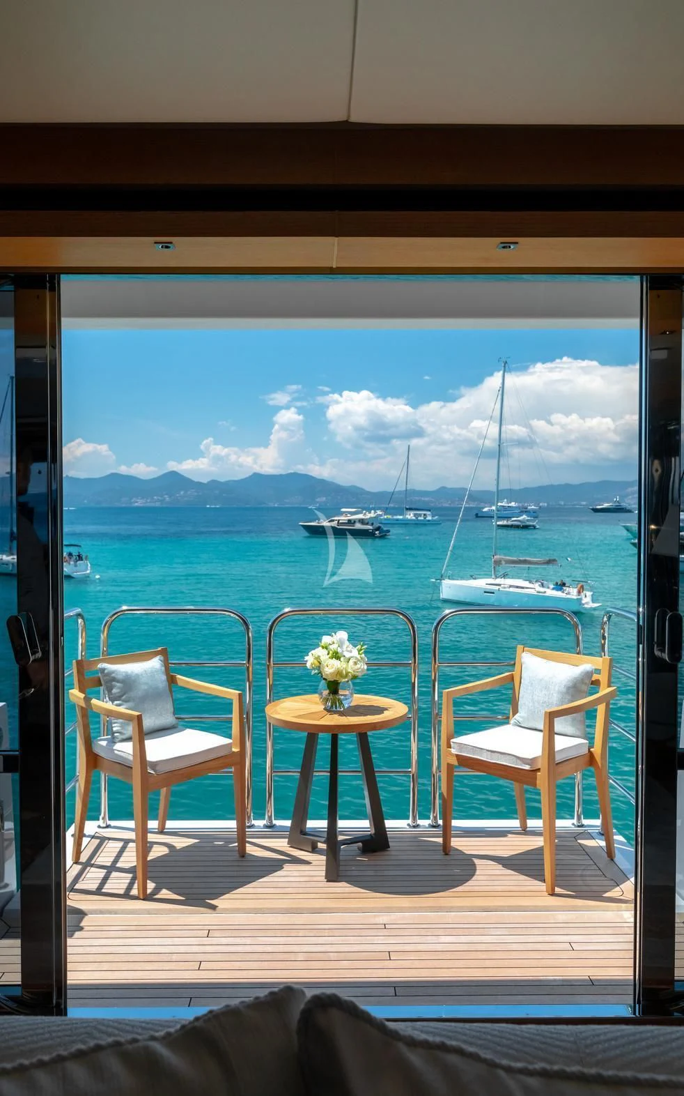 a room with a table and chairs aboard ARADOS Yacht for Charter