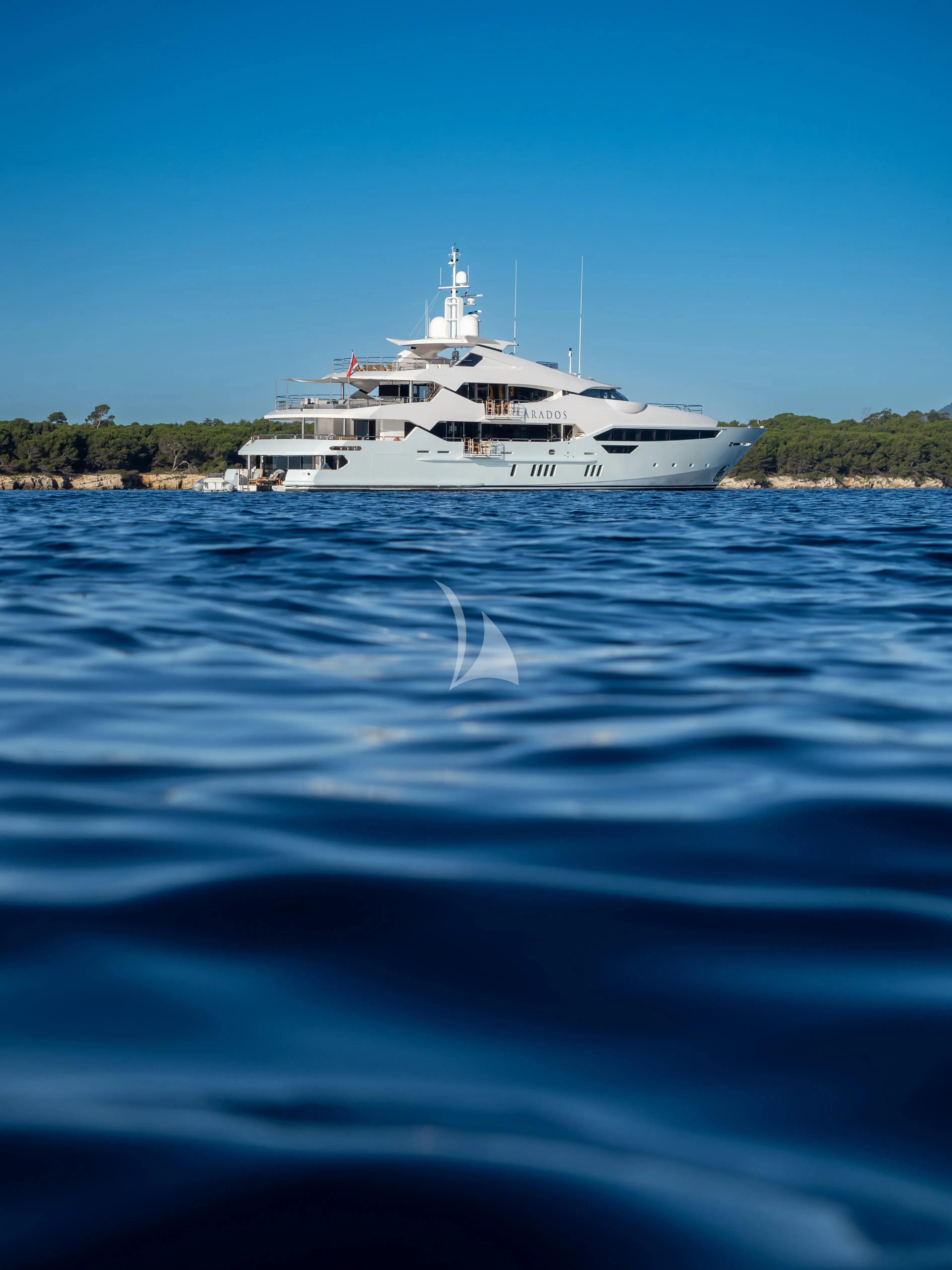 a white boat on water aboard ARADOS Yacht for Charter