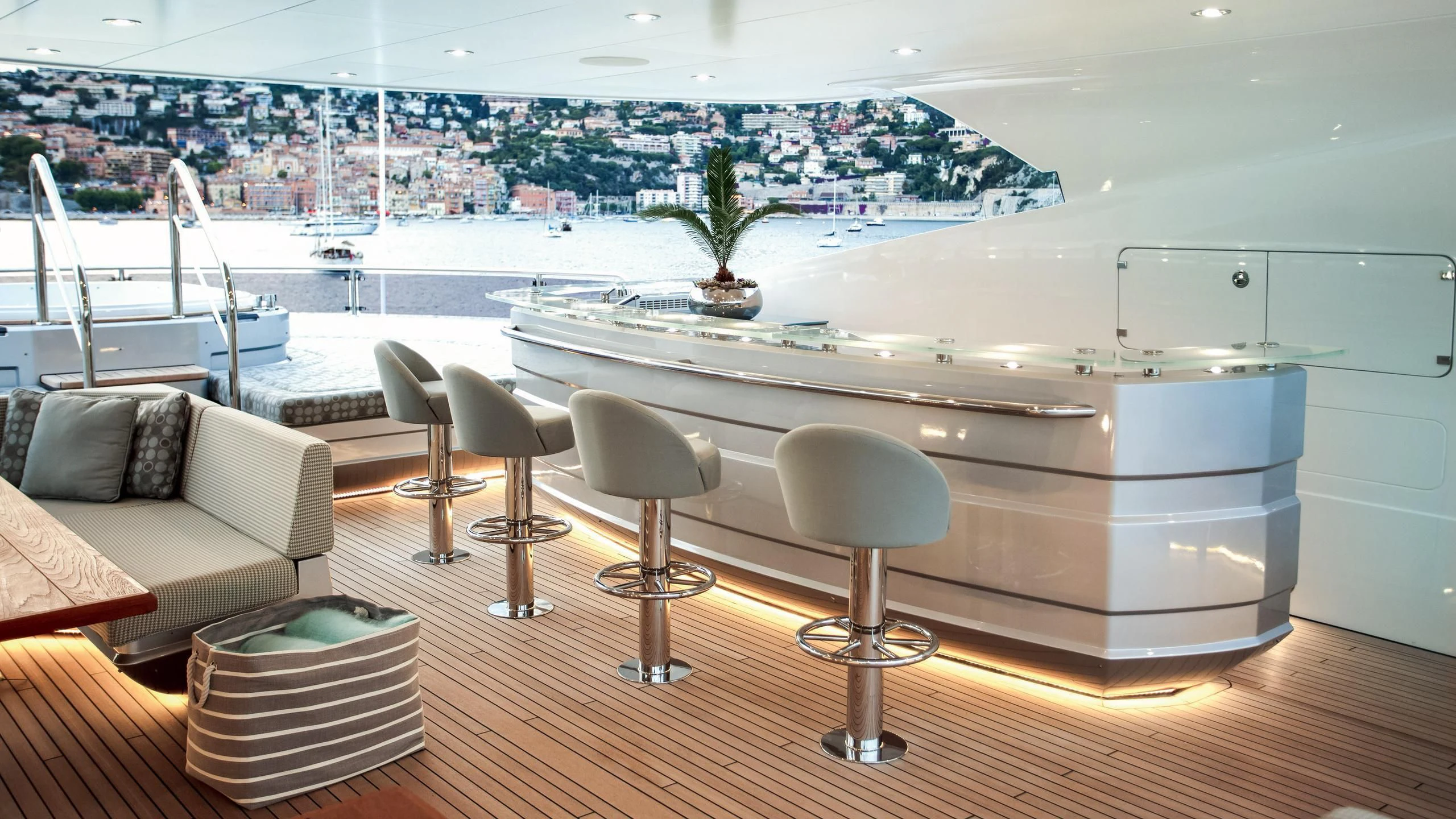 a room with a table chairs and a couch aboard ARADOS Yacht for Charter