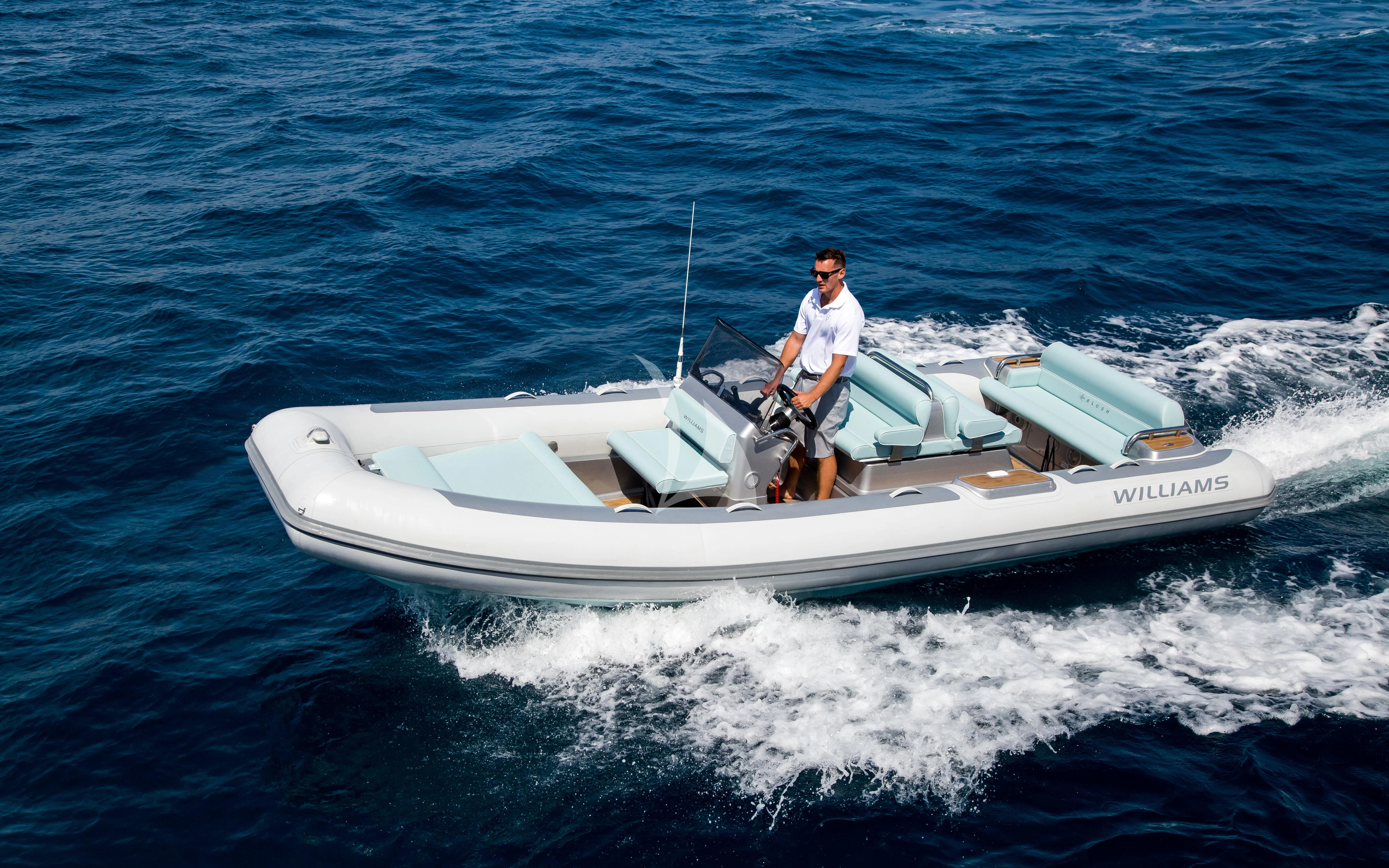 a man on a boat aboard ARADOS Yacht for Charter