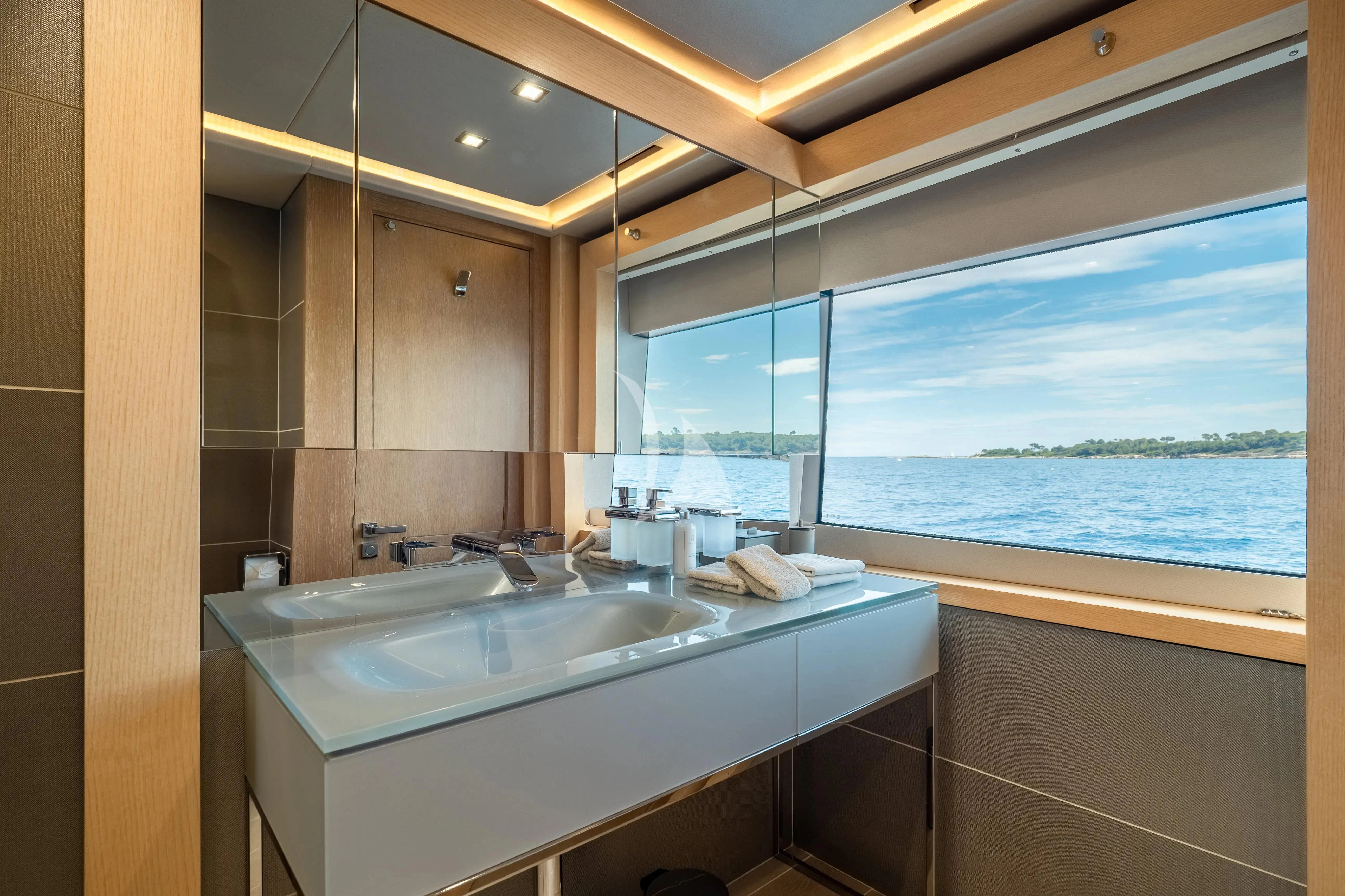 a bathroom with a large window aboard ARADOS Yacht for Charter