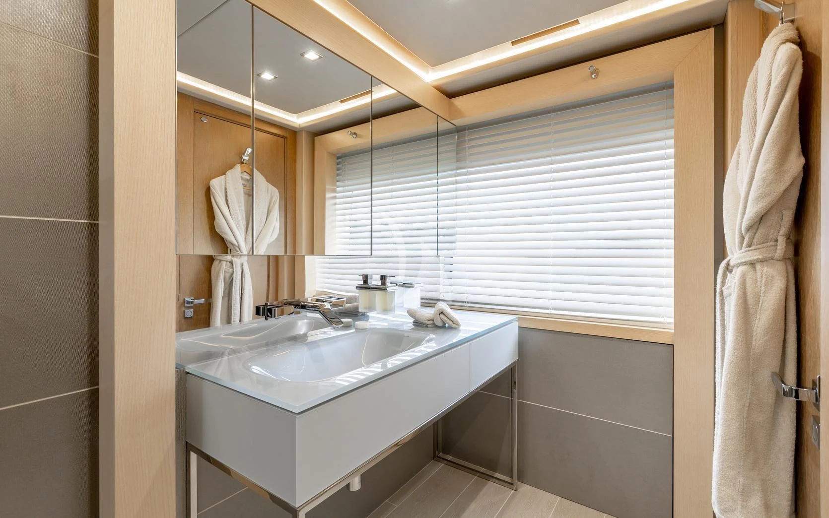 a bathroom with a sink and a mirror aboard ARADOS Yacht for Charter