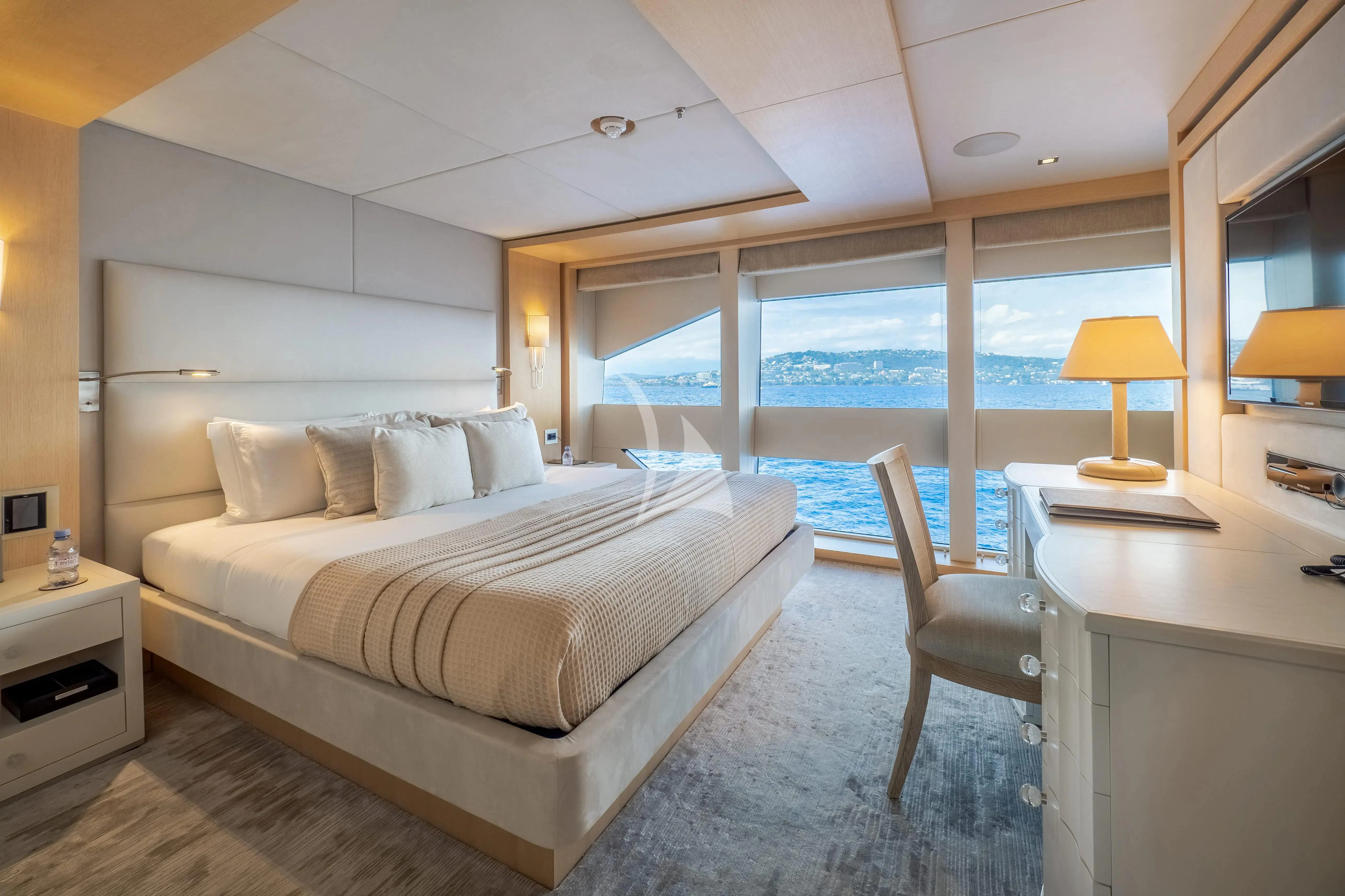 a bedroom with a large bed aboard ARADOS Yacht for Charter