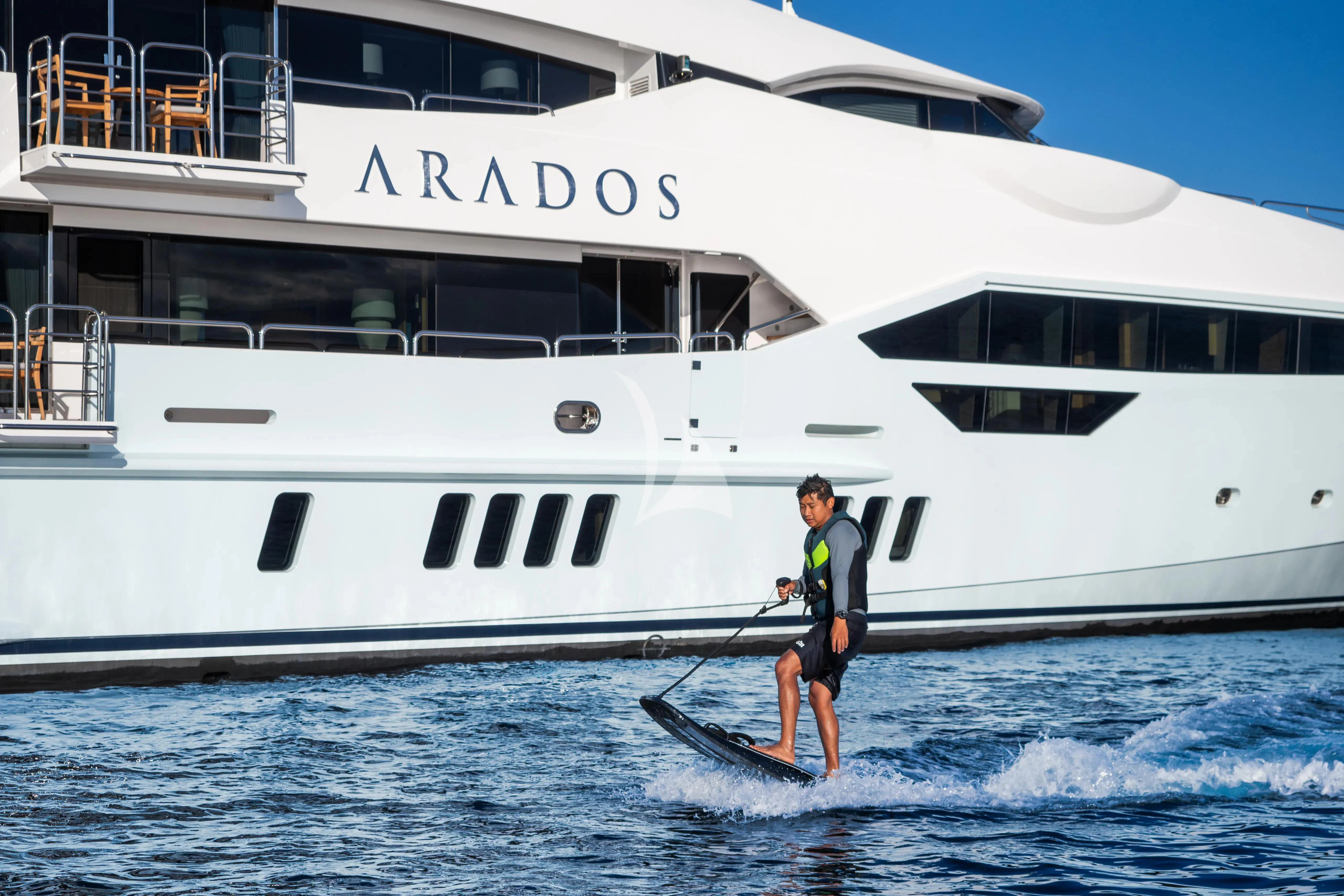 a person is water skiing aboard ARADOS Yacht for Charter