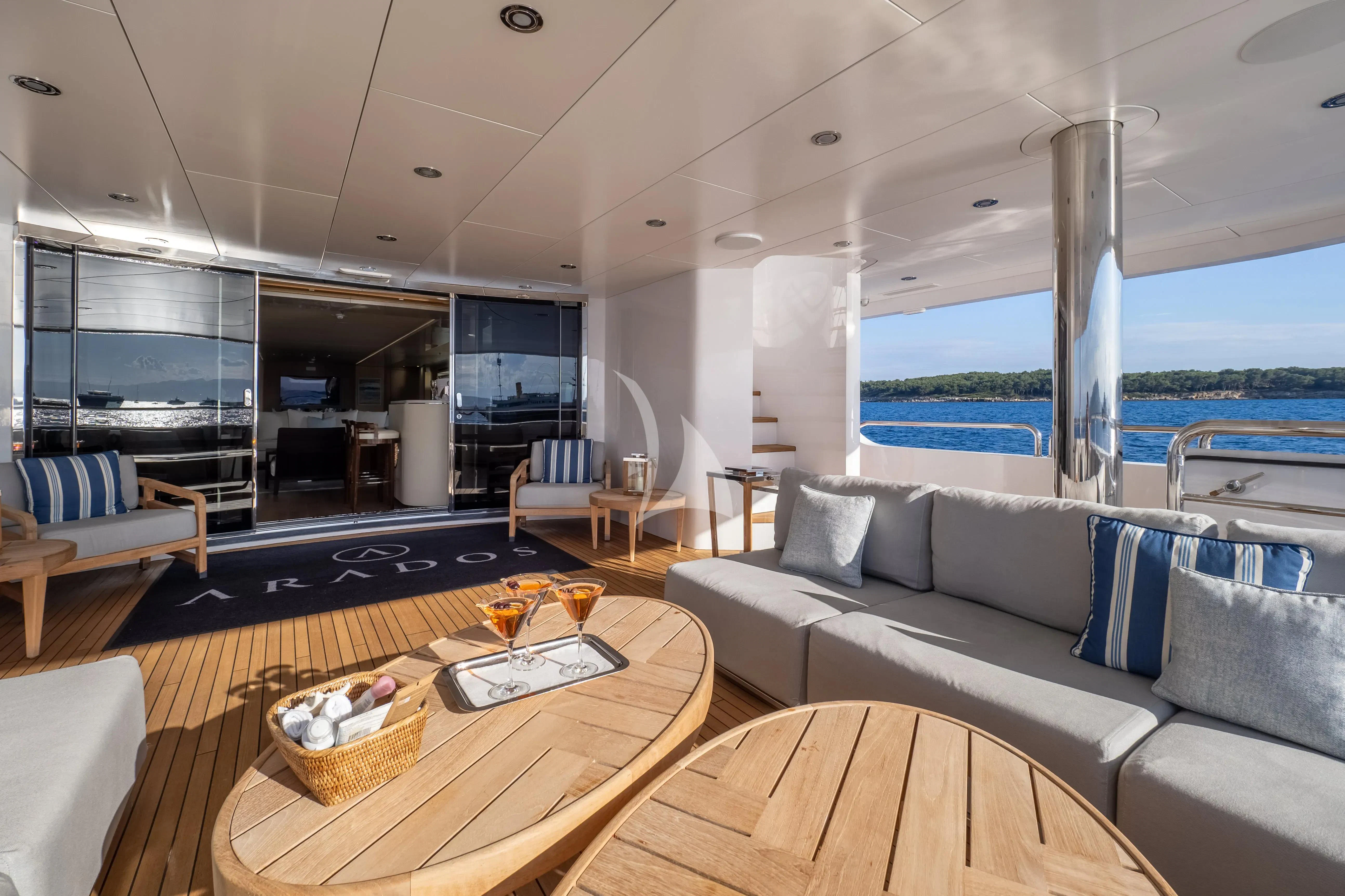 a living room with a large window aboard ARADOS Yacht for Charter