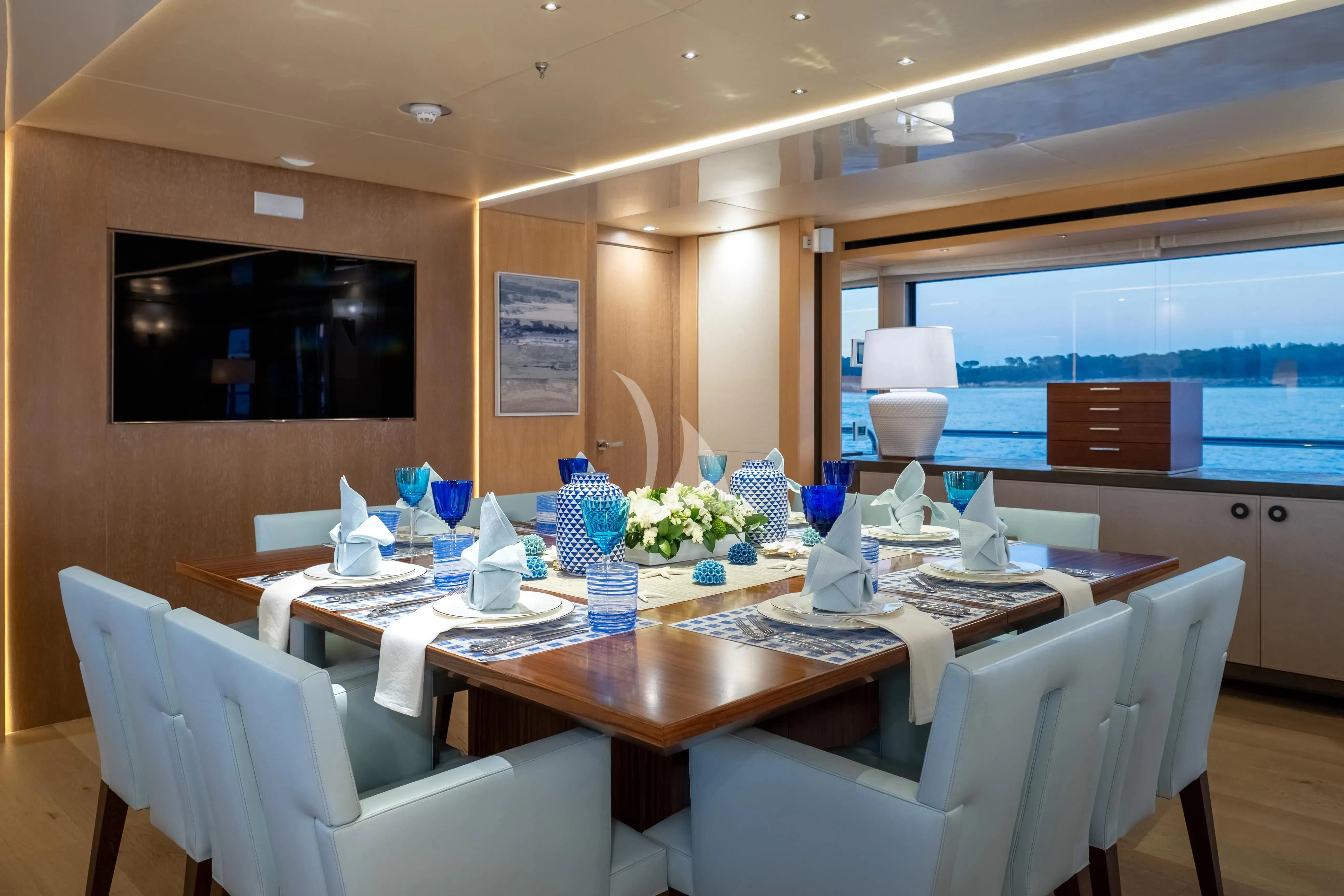 a dining room with a table and chairs aboard ARADOS Yacht for Charter