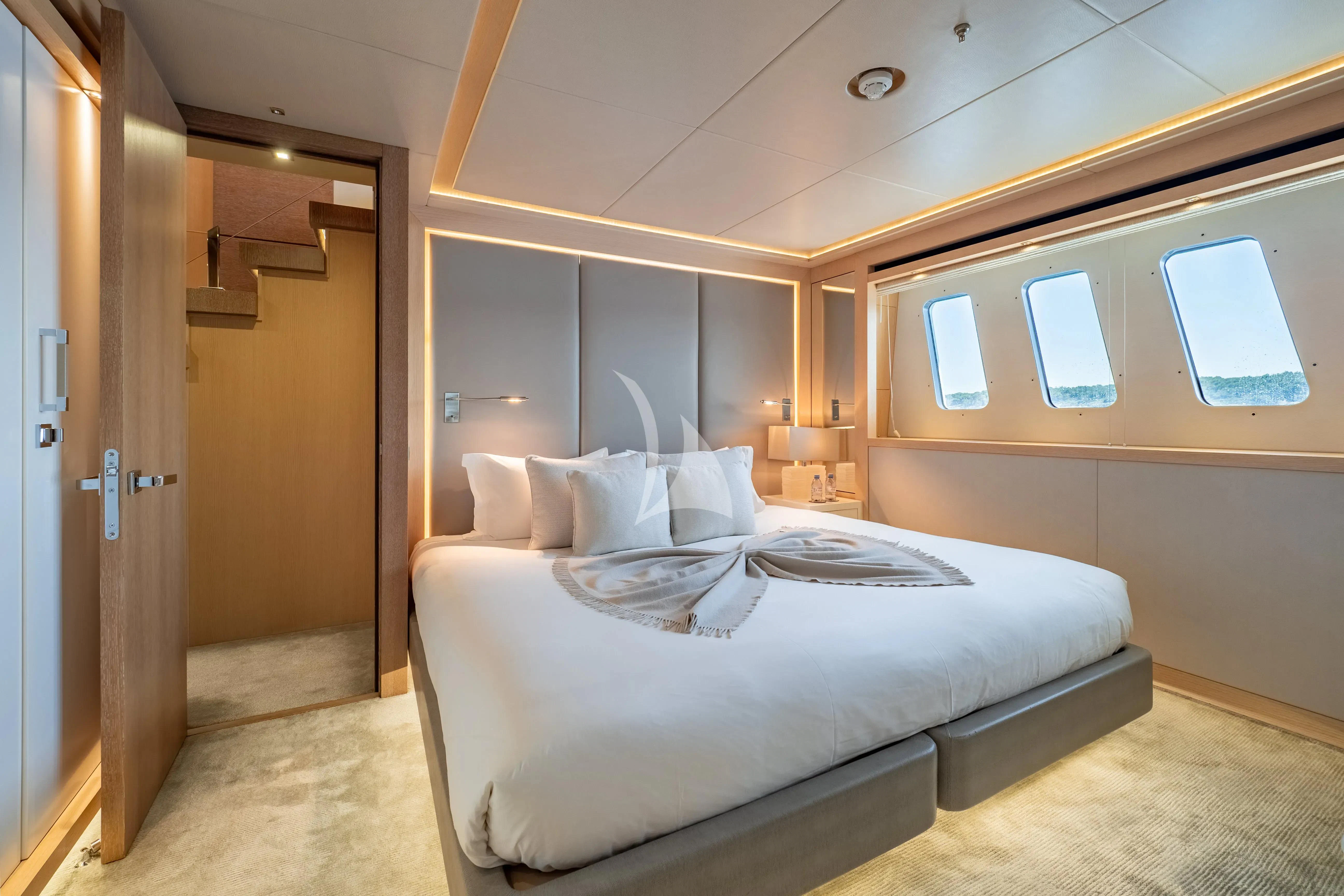 a bedroom with a bed and a closet aboard ARADOS Yacht for Charter