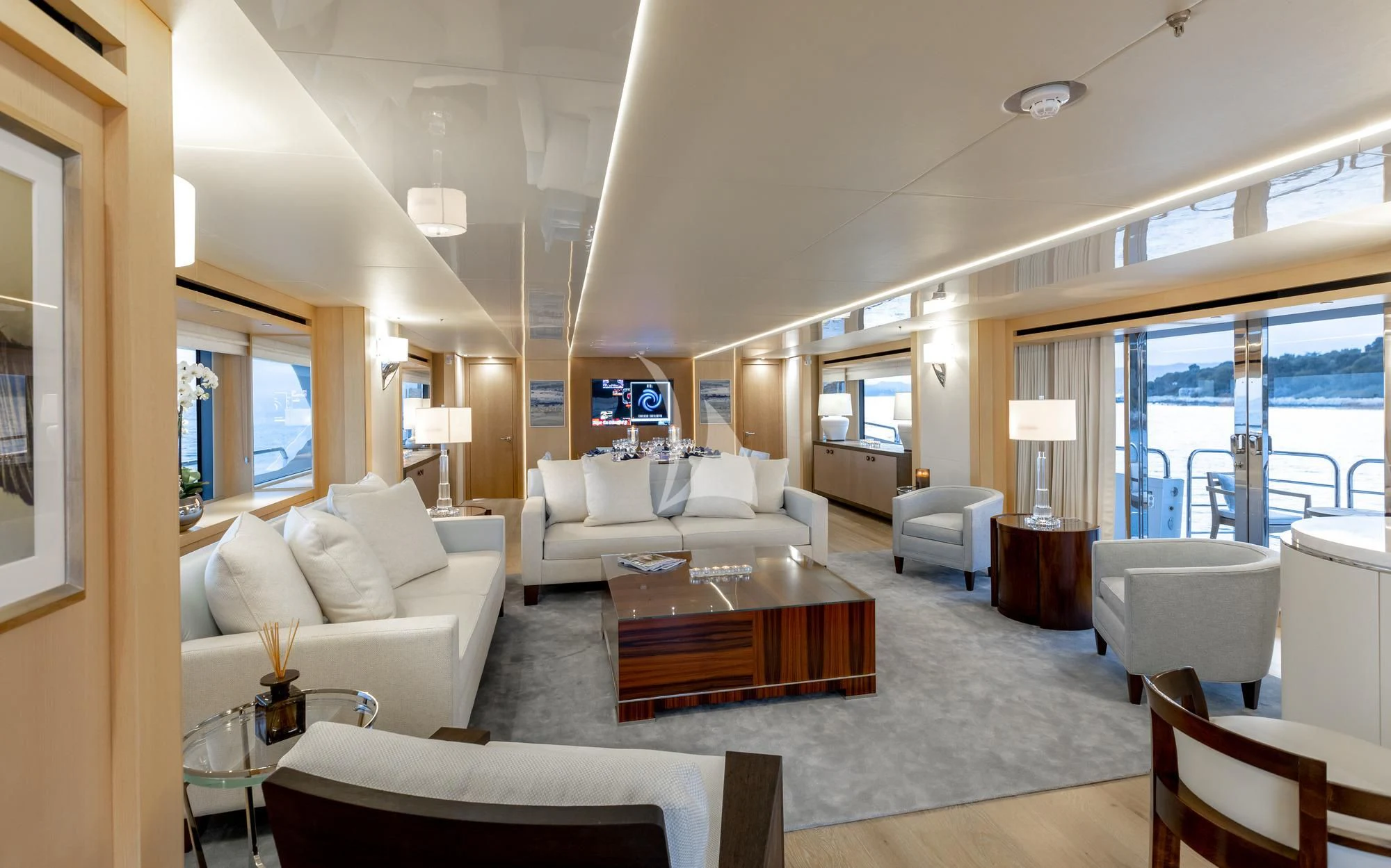 a living room with a large window aboard ARADOS Yacht for Charter
