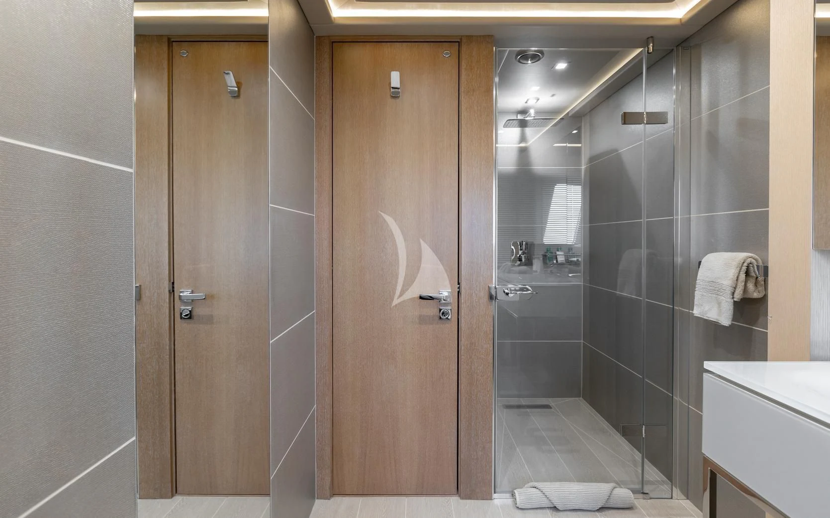 a bathroom with a shower unit and a sink aboard ARADOS Yacht for Charter