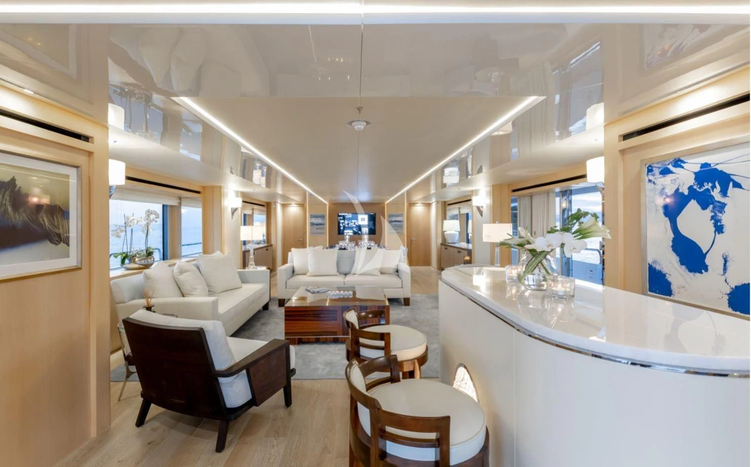 a living room with a kitchen and dining area aboard ARADOS Yacht for Charter