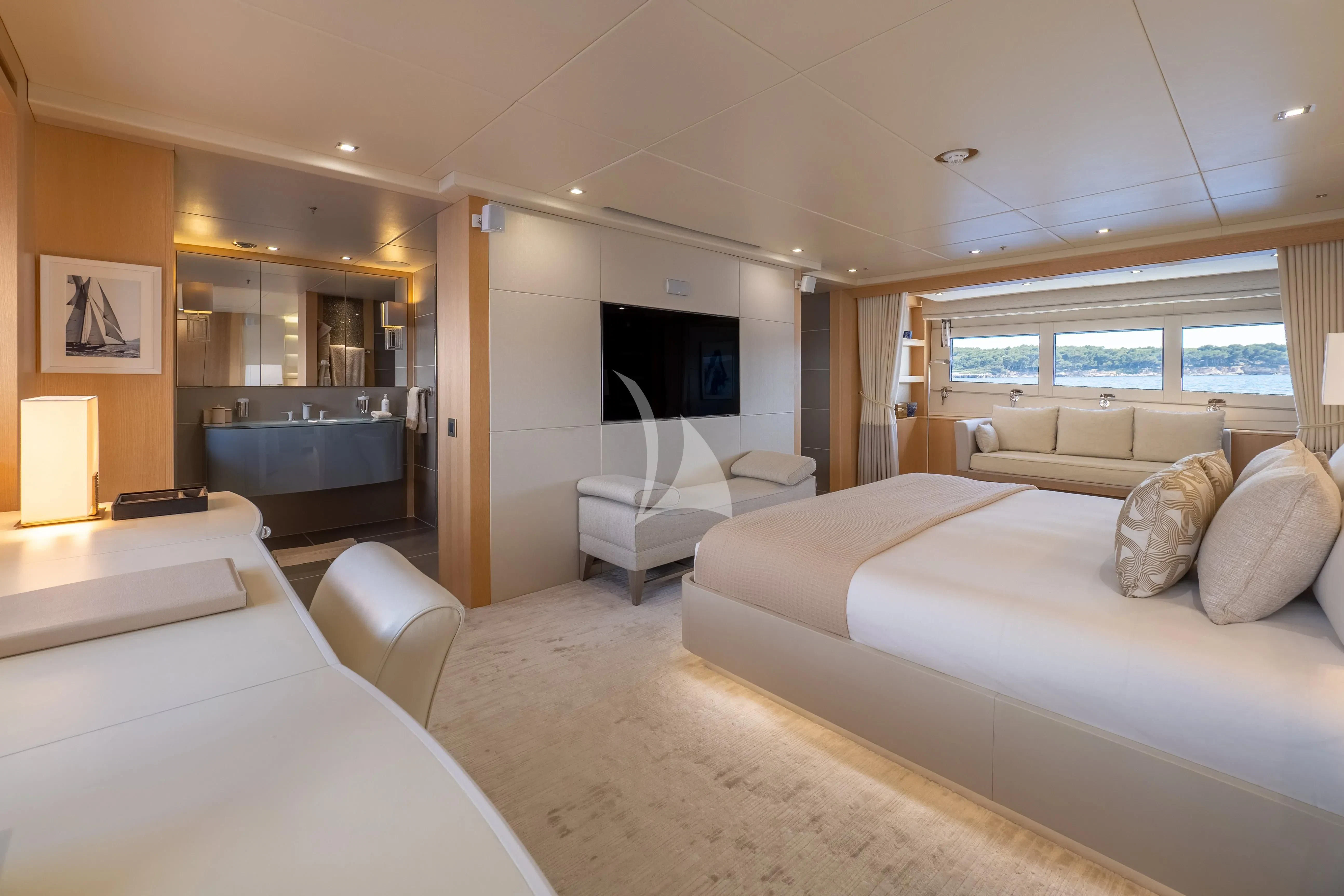 a living room with a large bed aboard ARADOS Yacht for Charter