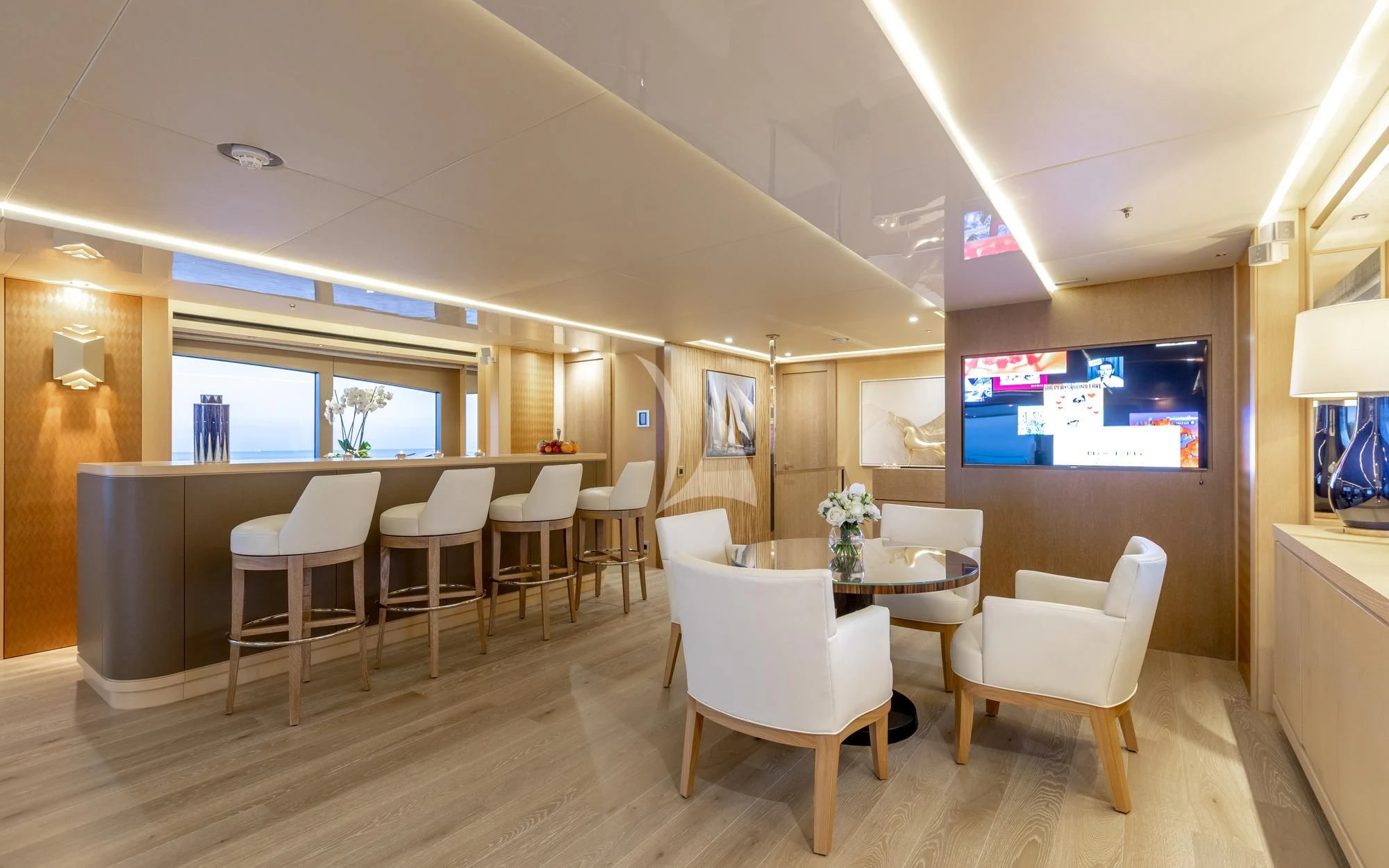 a room with tables and chairs aboard ARADOS Yacht for Charter