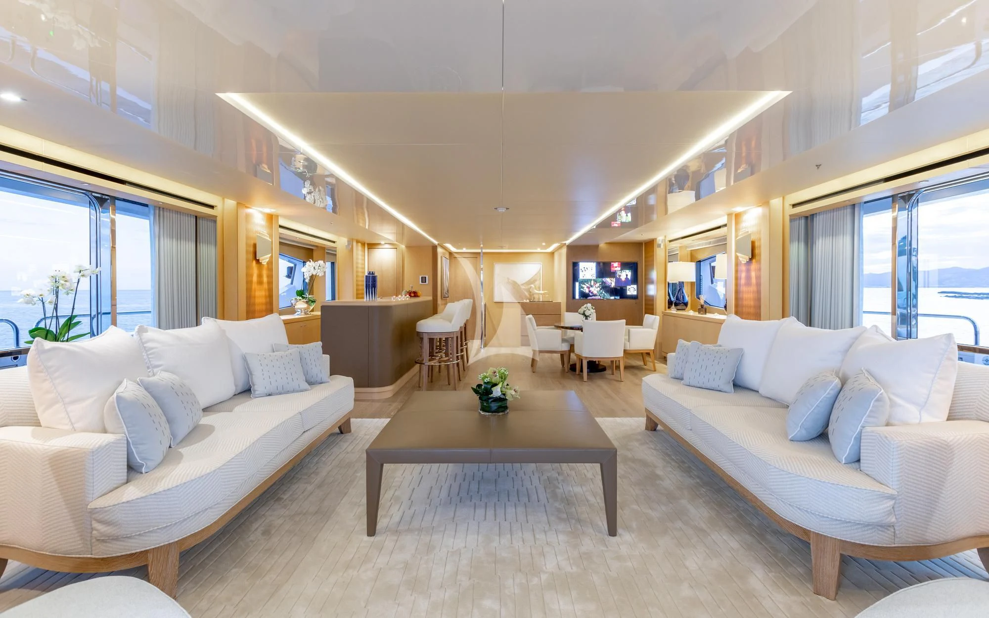 a living room with a couch and a coffee table aboard ARADOS Yacht for Charter