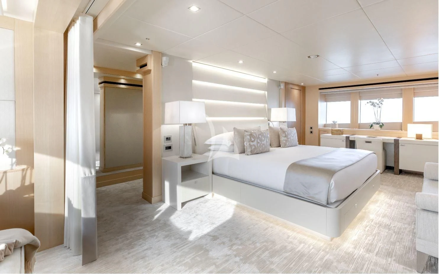 a large bedroom with a large bed aboard ARADOS Yacht for Charter