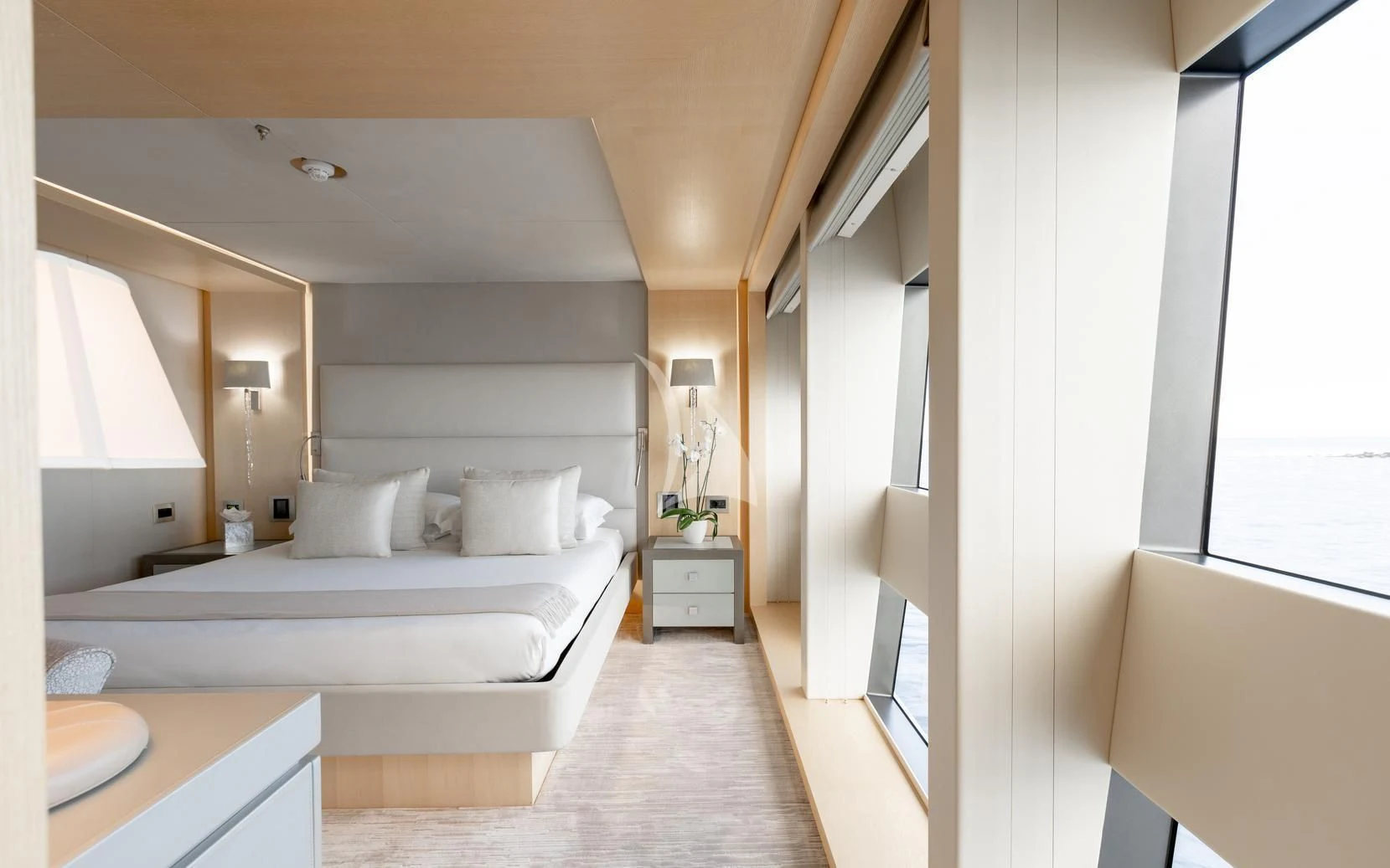 a room with a bed and a mirror aboard ARADOS Yacht for Charter