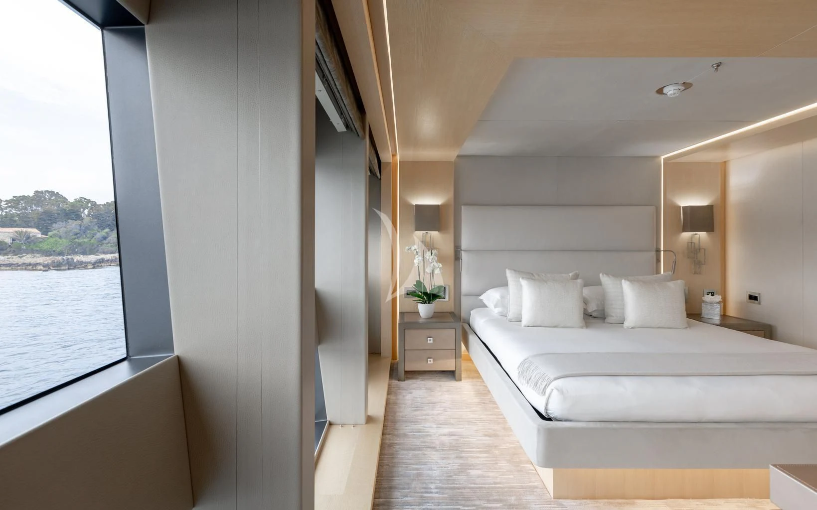 a room with a bed and a window aboard ARADOS Yacht for Charter
