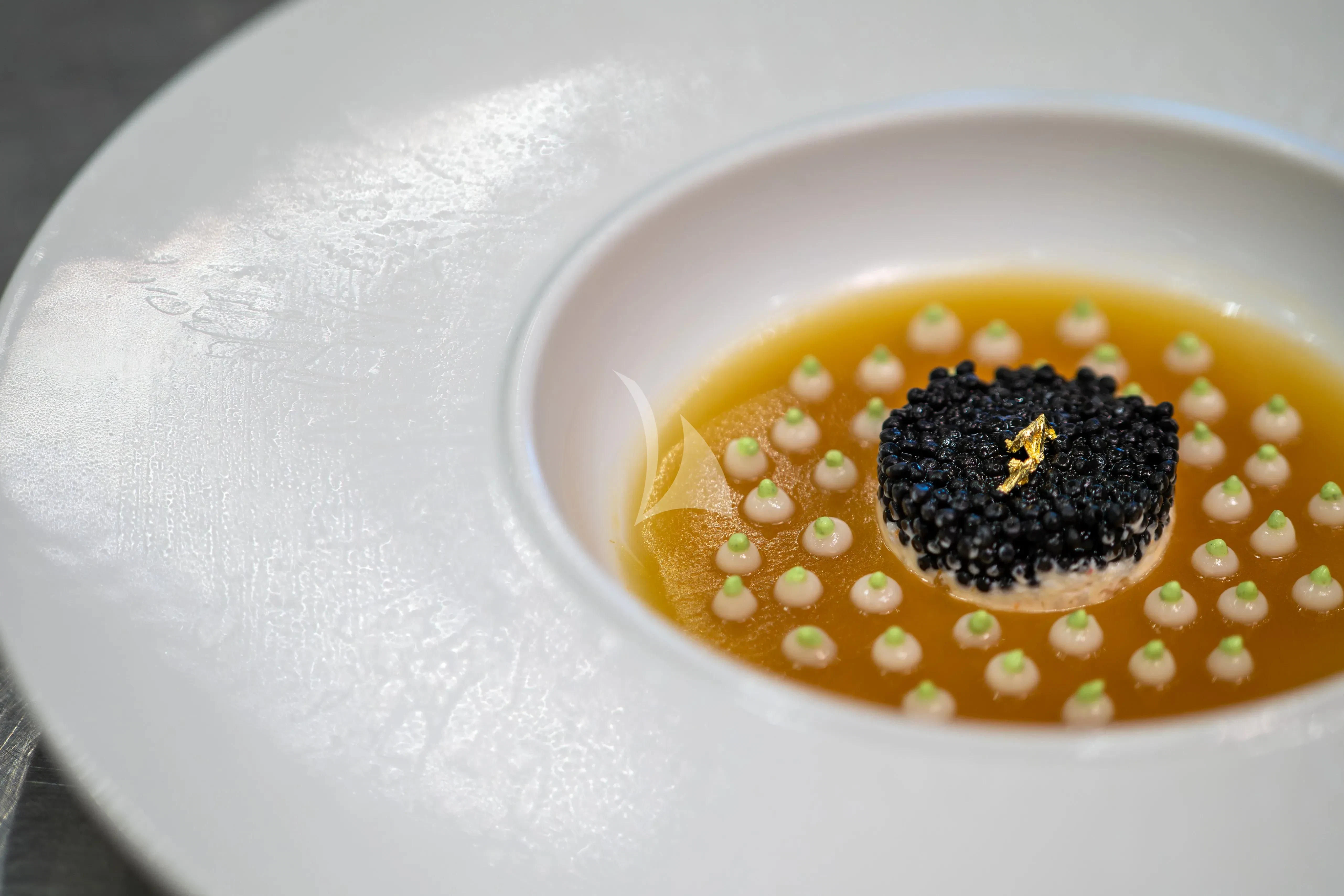 a white cup with a brown substance aboard ARADOS Yacht for Charter