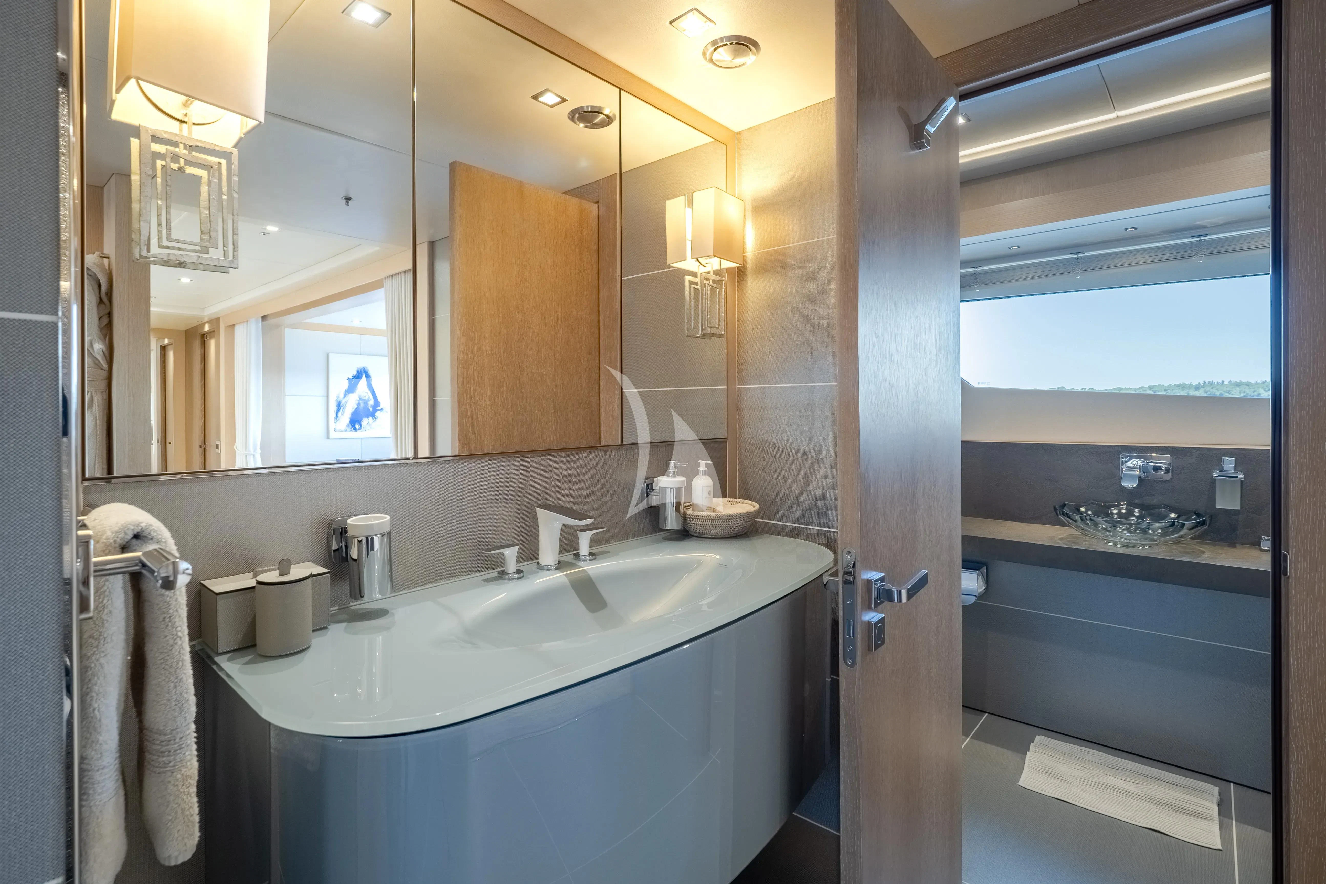 a bathroom with a large mirror aboard ARADOS Yacht for Charter