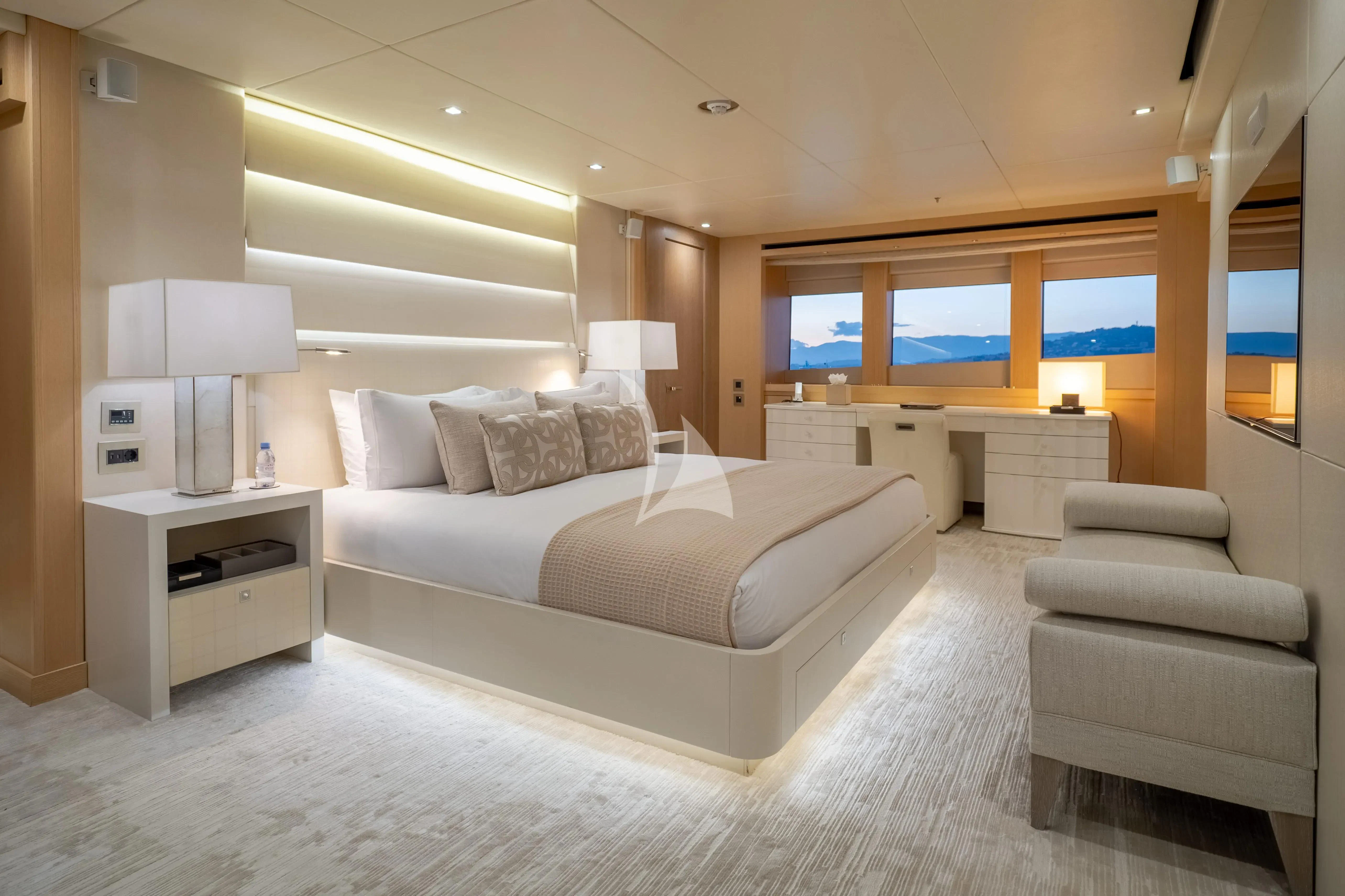 a large white bed in a room aboard ARADOS Yacht for Charter