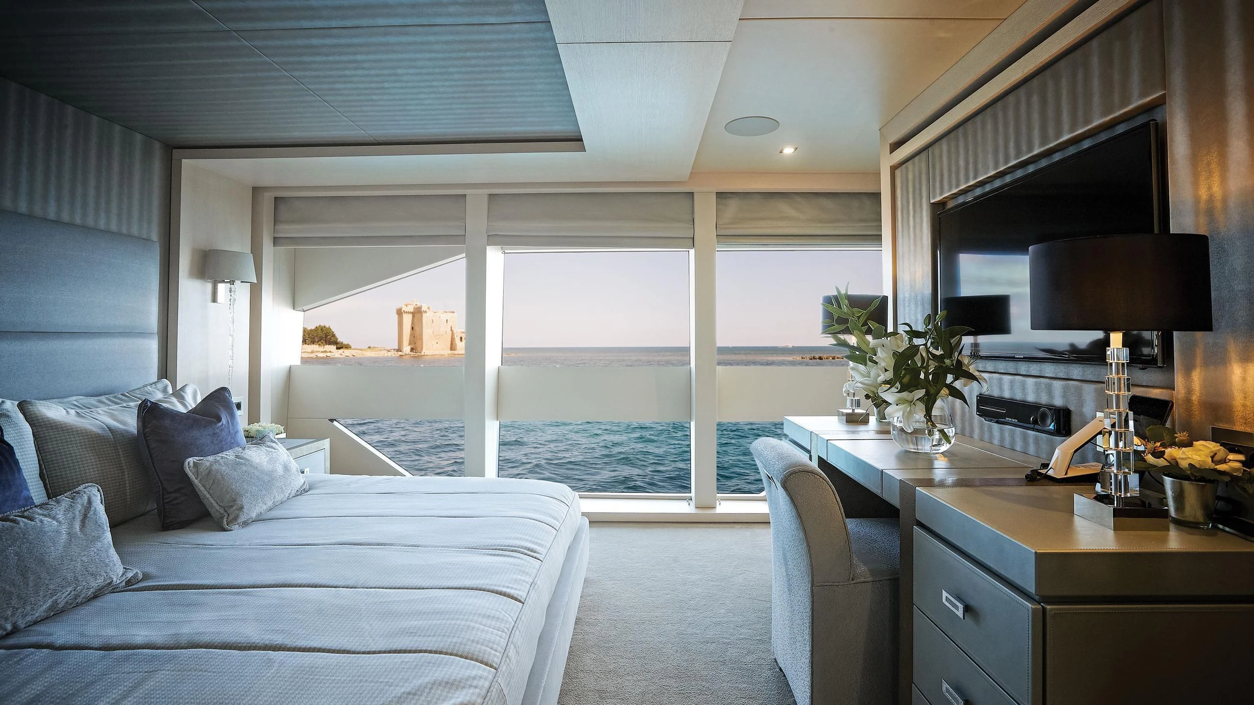 a living room with a large balcony aboard ARADOS Yacht for Charter