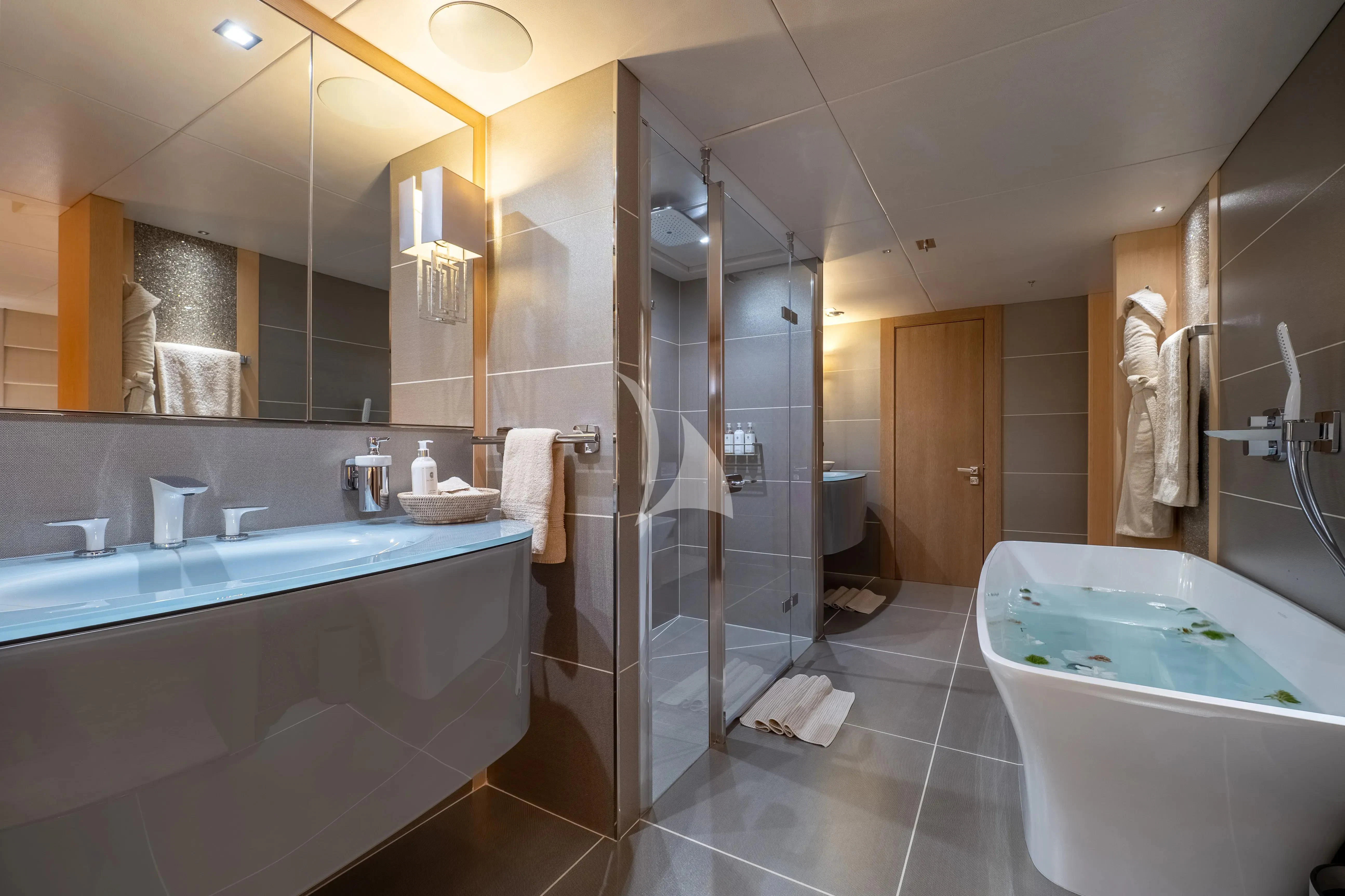 a bathroom with a glass shower aboard ARADOS Yacht for Charter