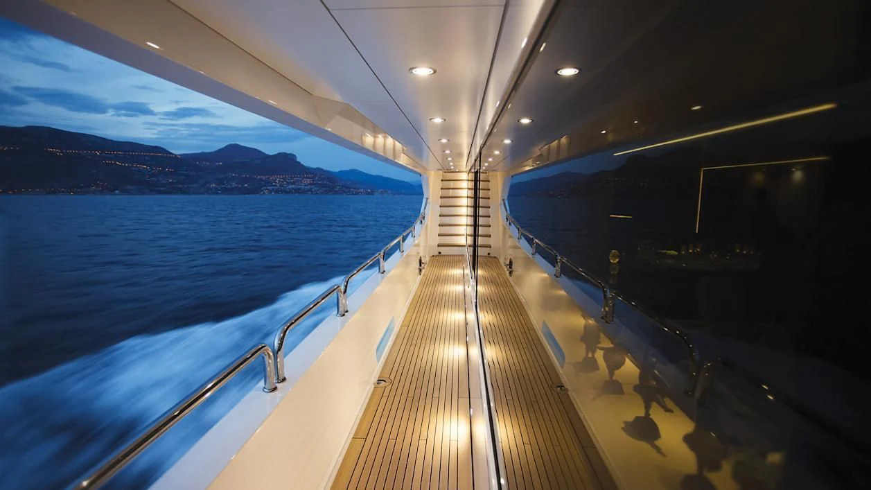 a long wooden dock leading to a large body of water aboard ARADOS Yacht for Charter