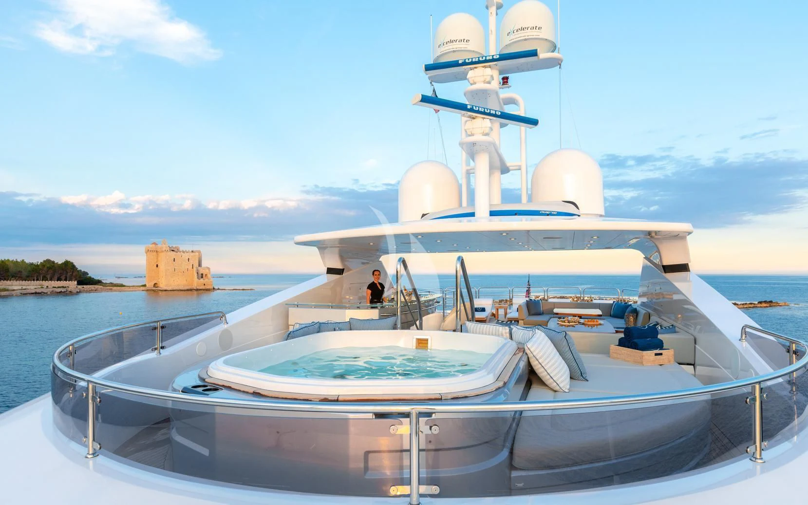 a large white ship with a satellite dish on it aboard ARADOS Yacht for Charter